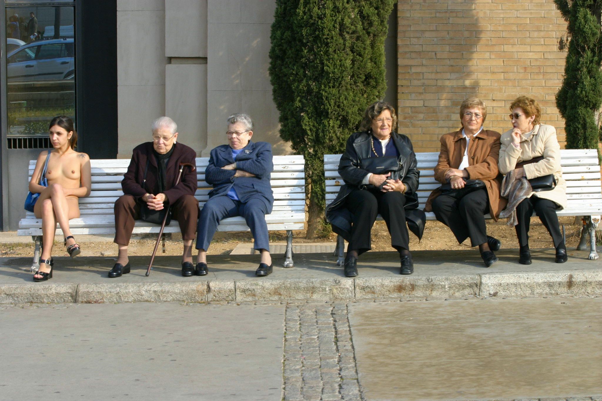 Paula Is Sitting Casually Naked On A Very Public Bench In Barcelona