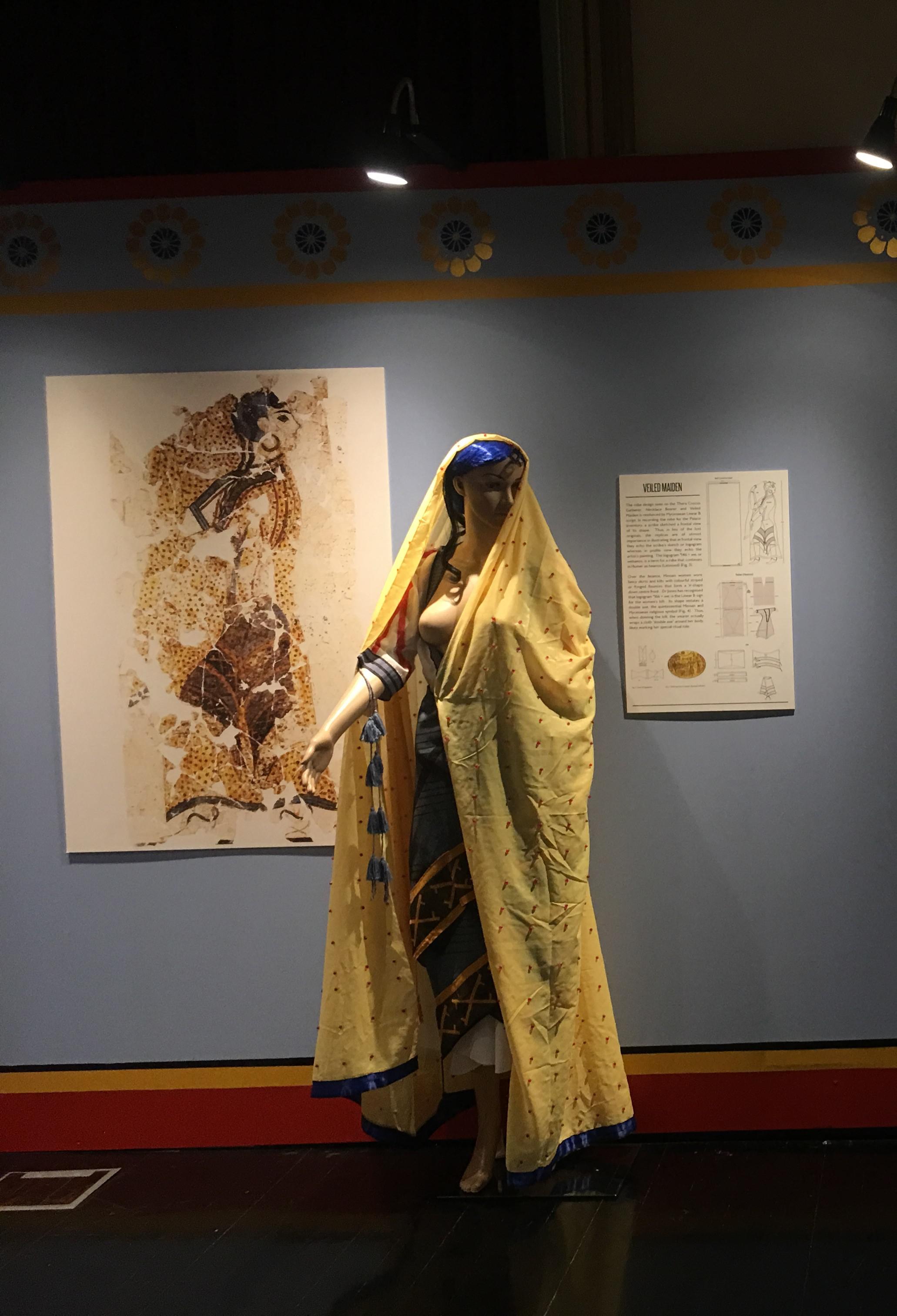 Recreation Of A Veiled Maiden In Minoan Dress Based On A Fresco Found