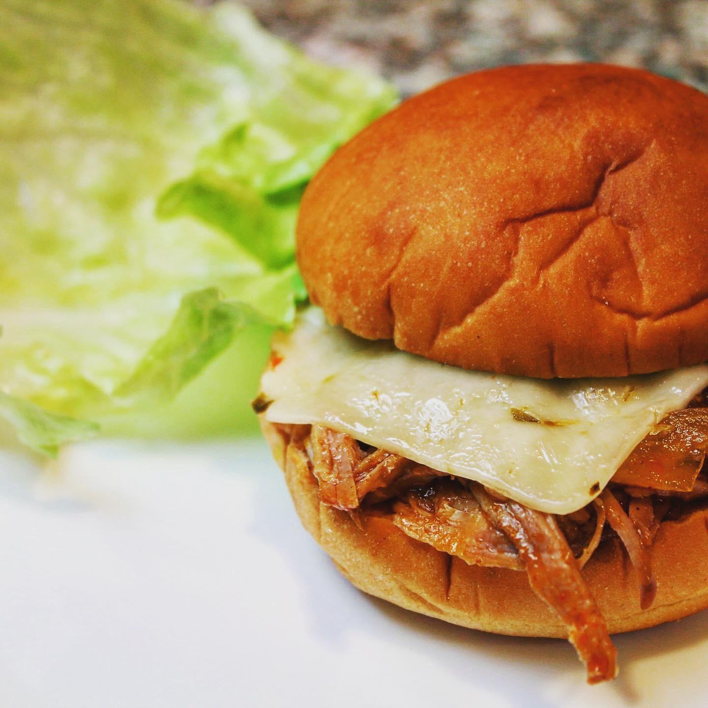 Slow Cooker BBQ Pulled Pork with Jalapeño cheese on potato bread