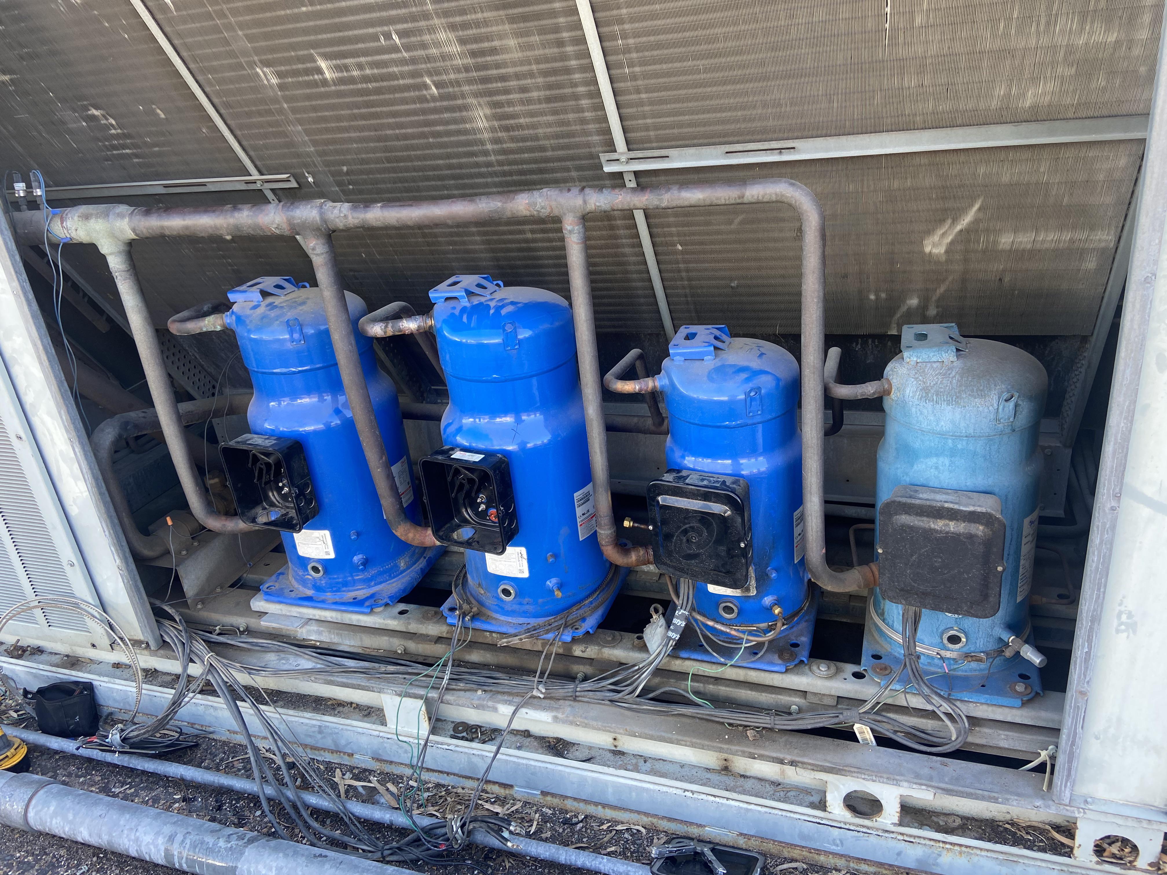 2 compressor change out. On the ground in a parking lot. Scrolller