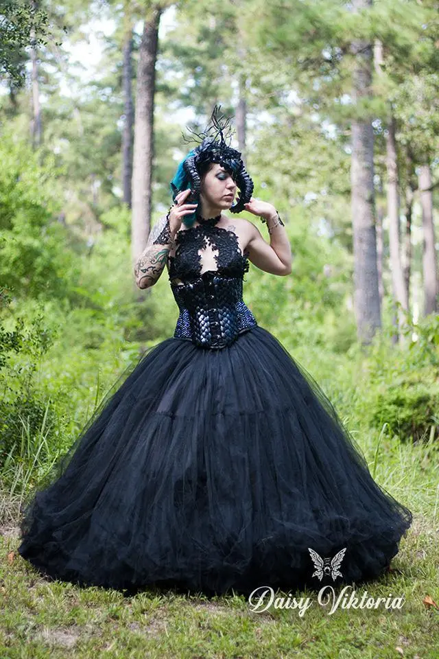 A dark fantasy corset ballgown I made! Tulle skirt with hand sewn lace bodice and underbust corset embellished with rhinestones and scale maille, and a horned headpiece. Modeled by Lindy Vaughn Thailore