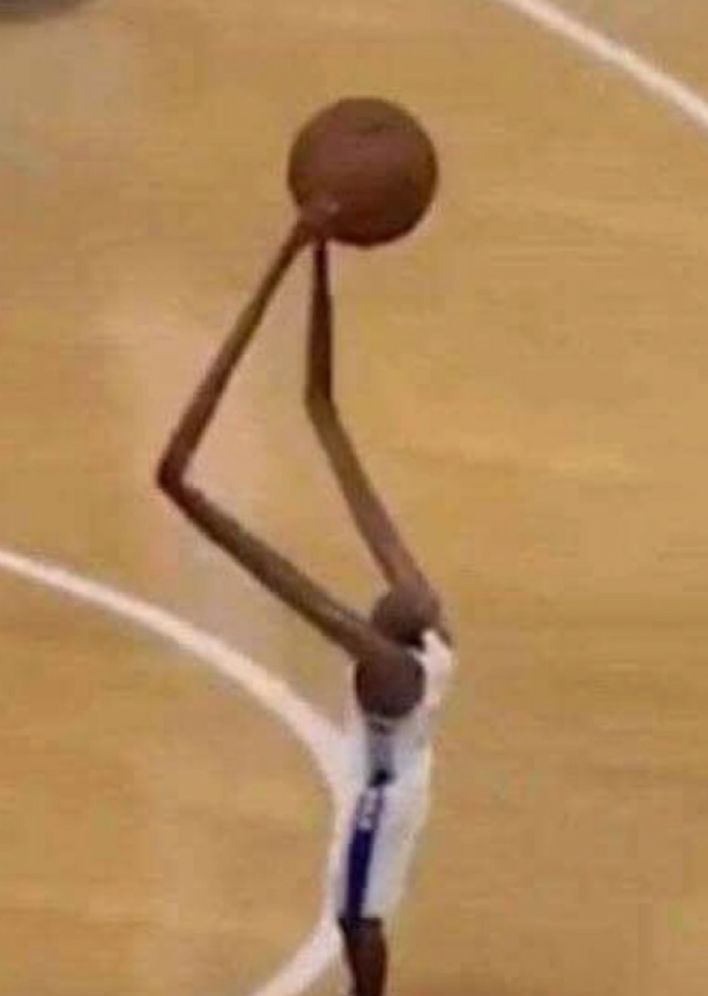 A rare photo of Manute Bol