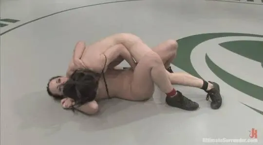 Alexa von Tess and Brix in a girl on girl wrestling match, pinning each other in black lingerie
