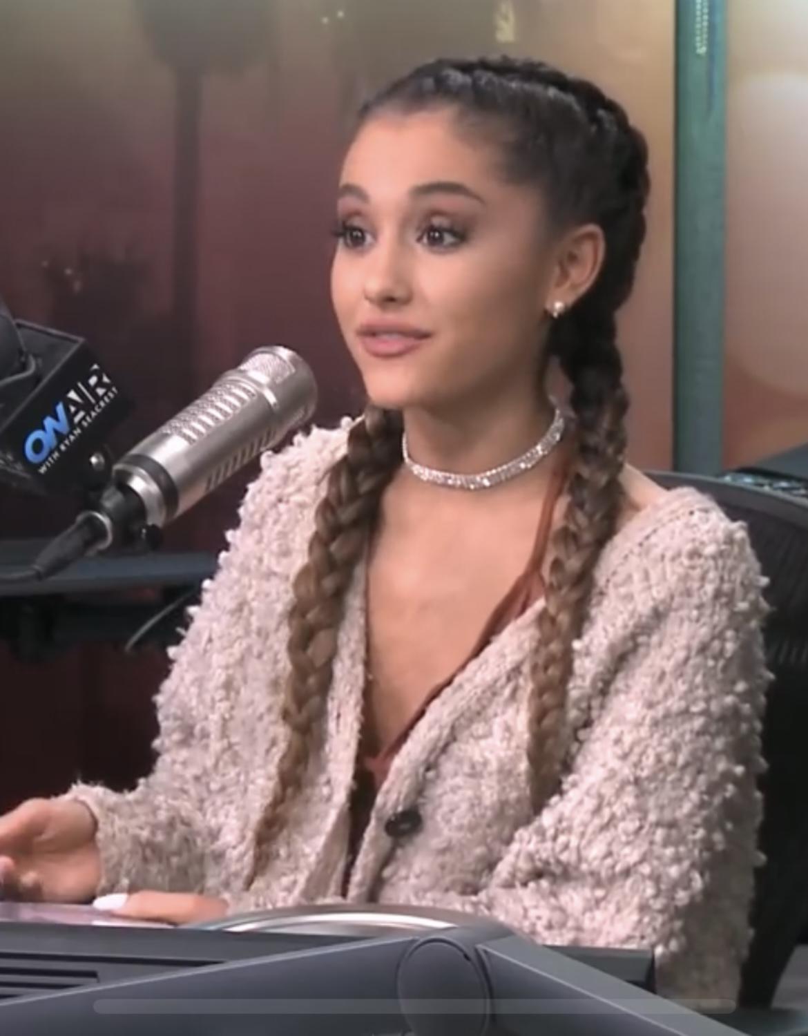 Ariana Grande with two braids during interview | Scrolller