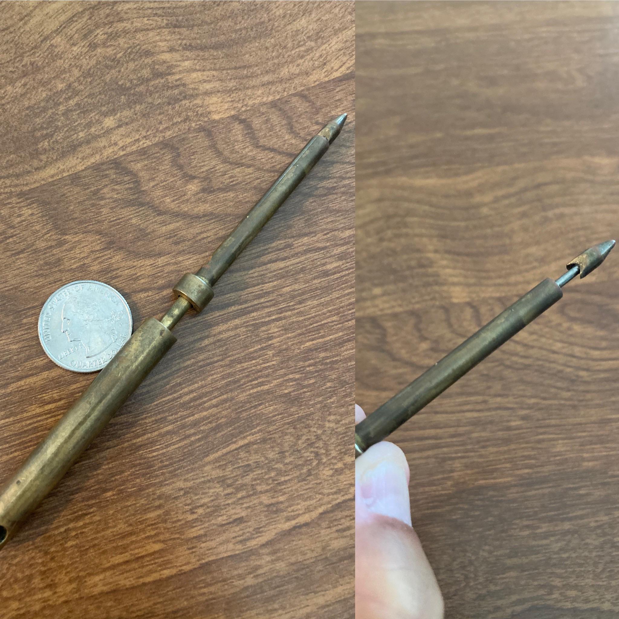 Brass, heavy for its size, spring-loaded end reveals sharpened barb ...