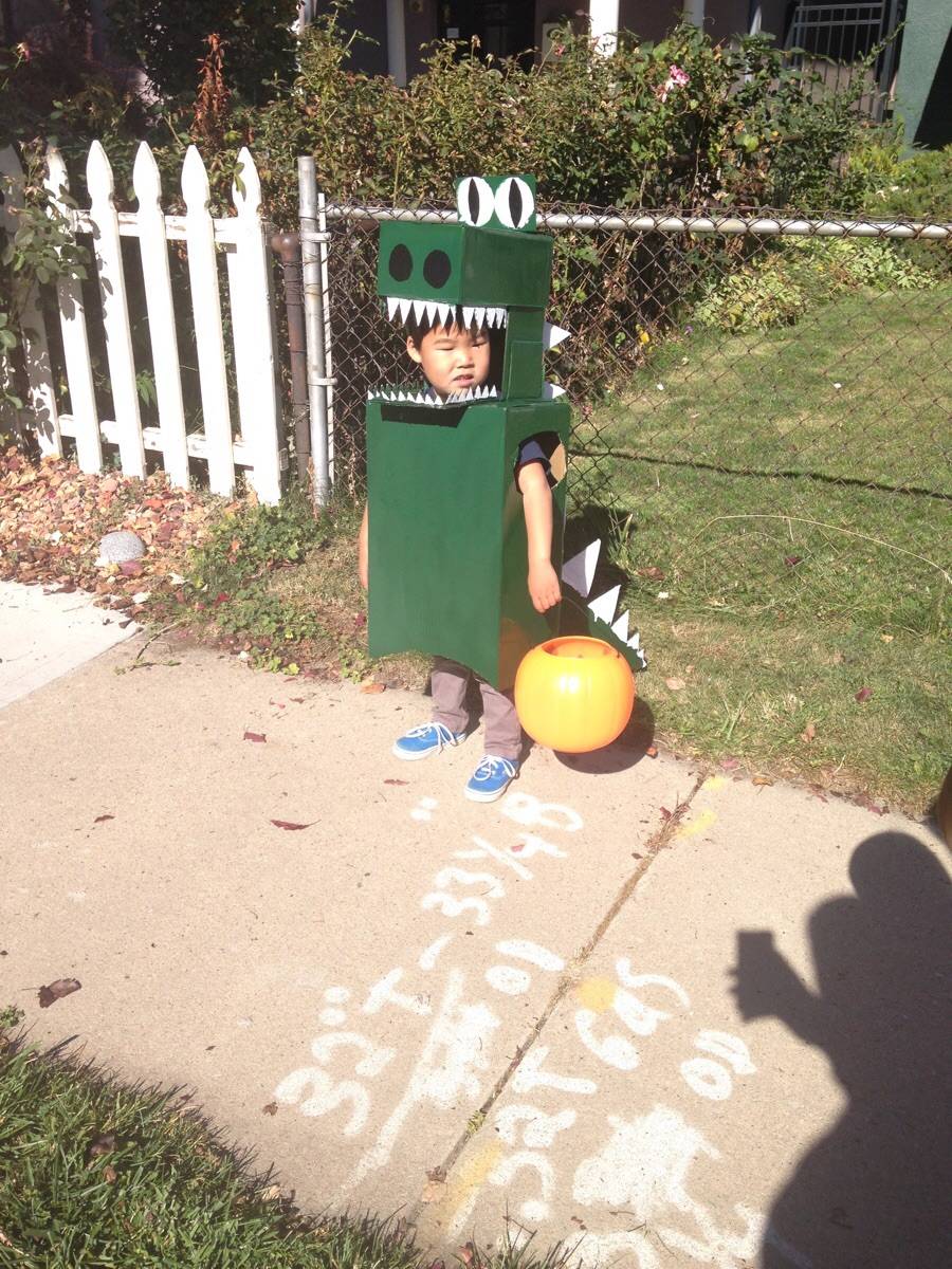 Cardboard + spray paint + duct tape = dinosaur! Scrolller