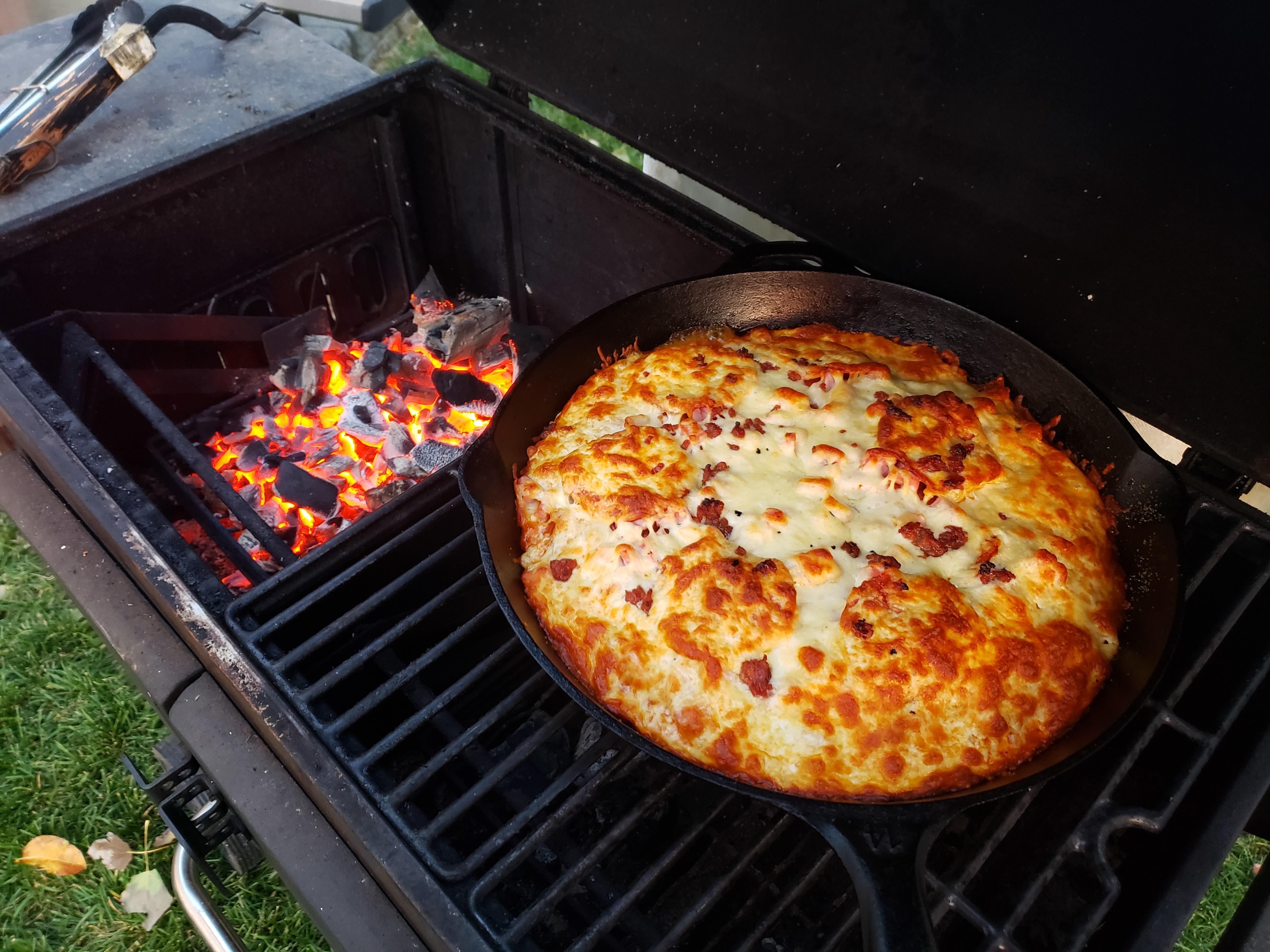 Castiron deep dish pizza baked with charcoal. Turned out incredible ...