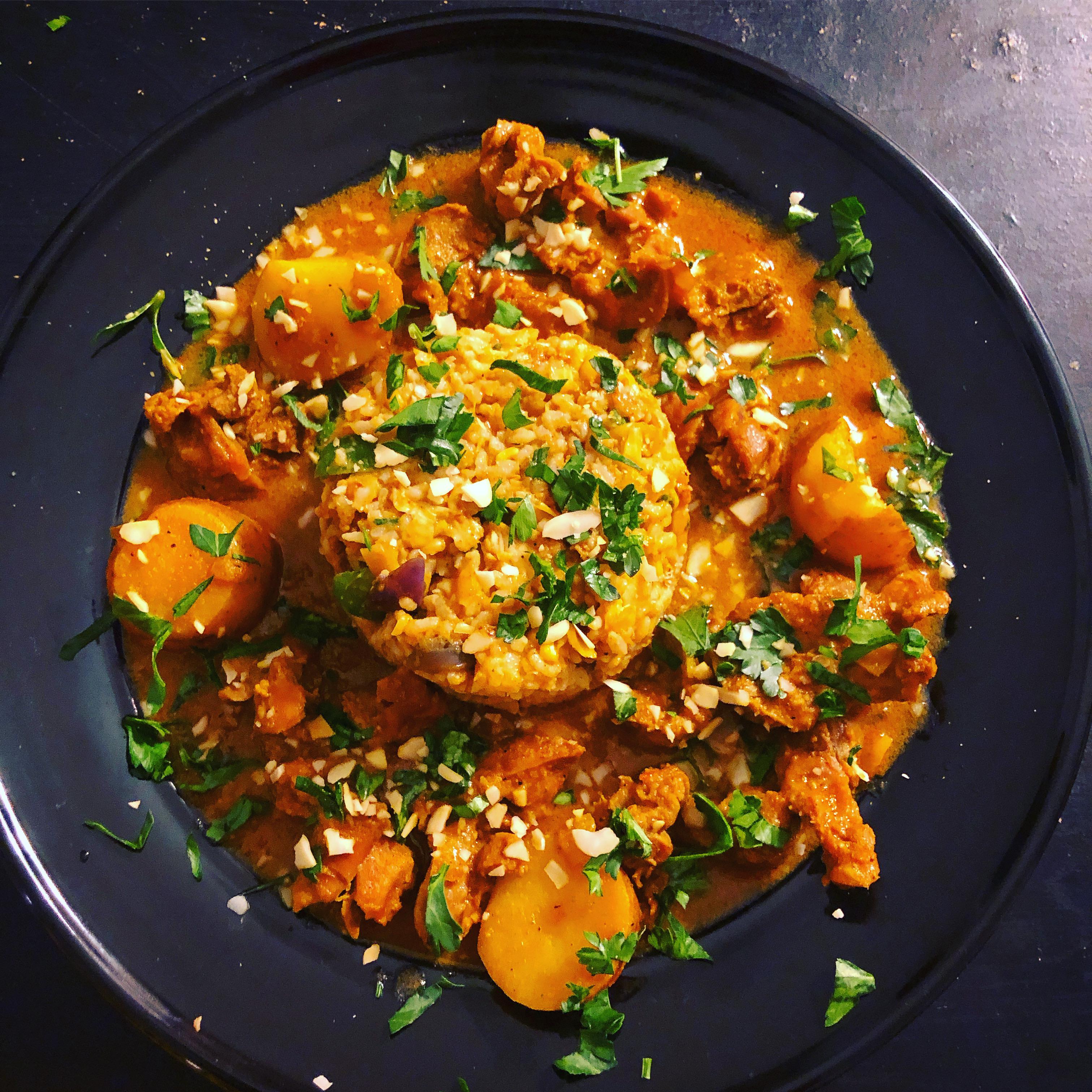 Chicken fried rice with chicken gizzards with potatoes. Garnished with ...