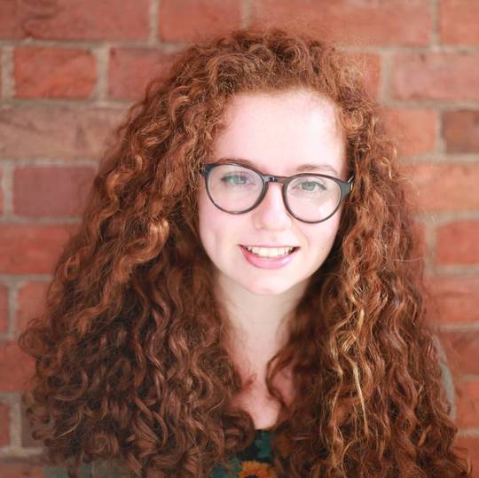 Curly Redhead with Glasses