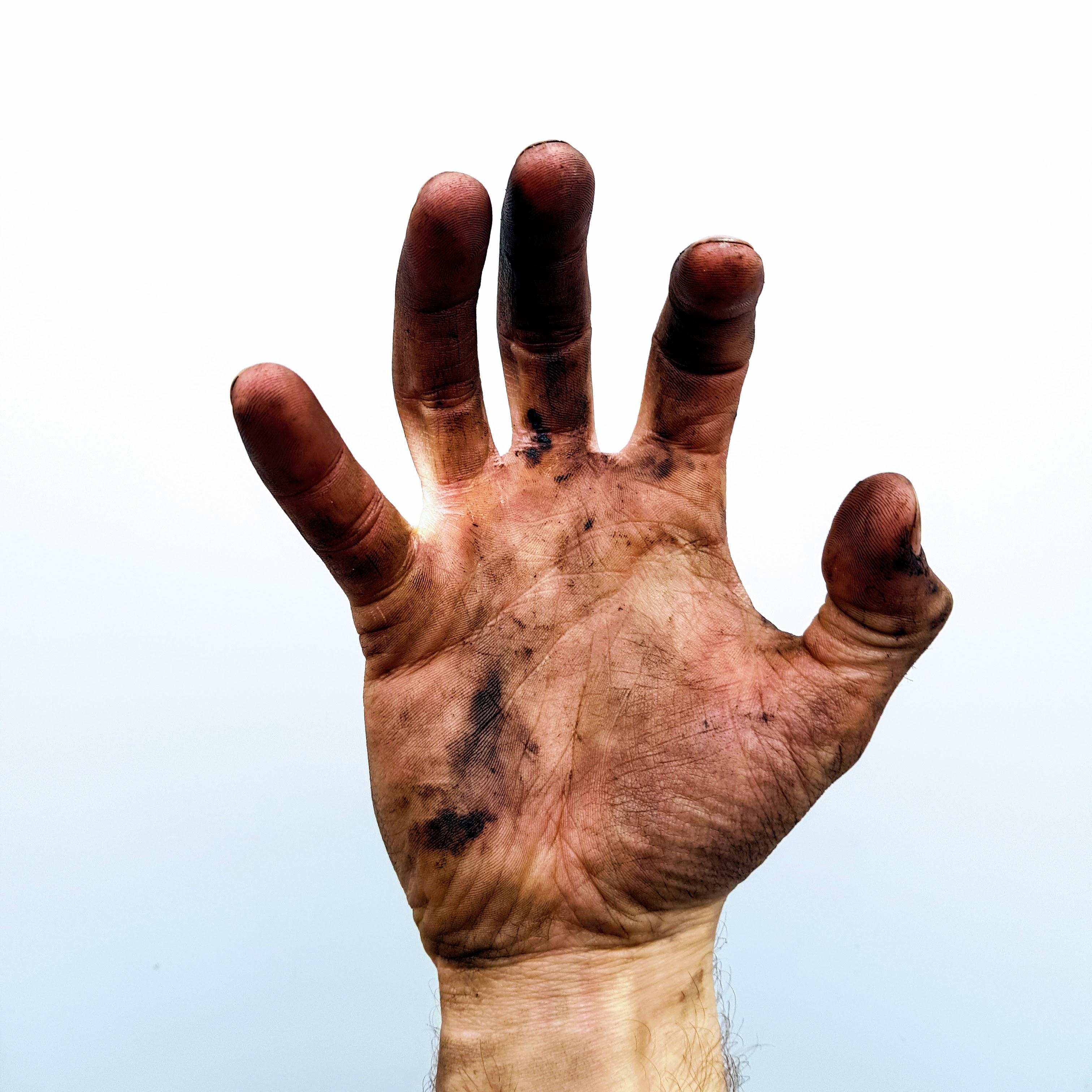 Dirty, oily hand. | Scrolller