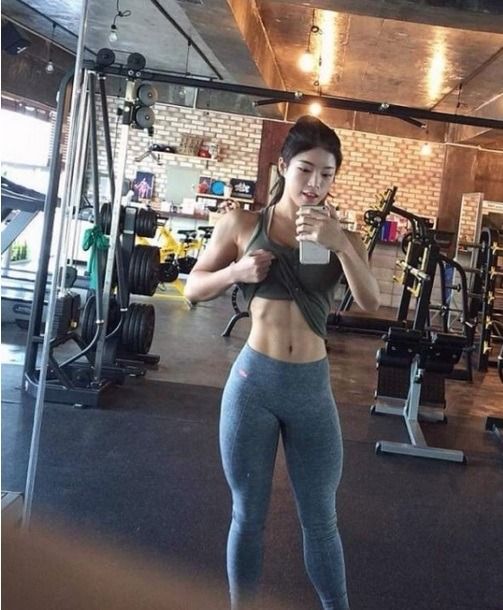 Fit Asian Girl Taking A Selfie Scrolller
