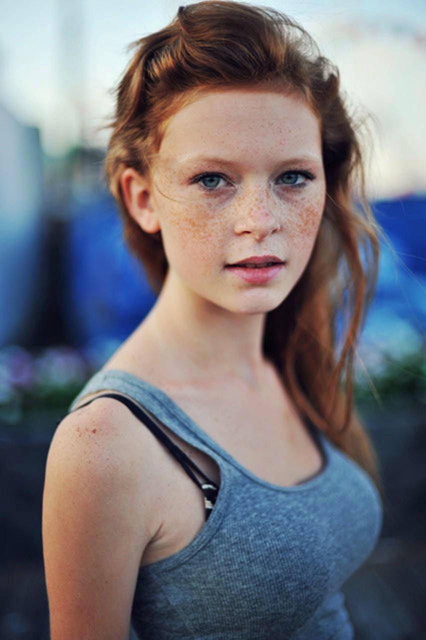 Freckled Redhead With Beautiful Blue Eyes Scrolller