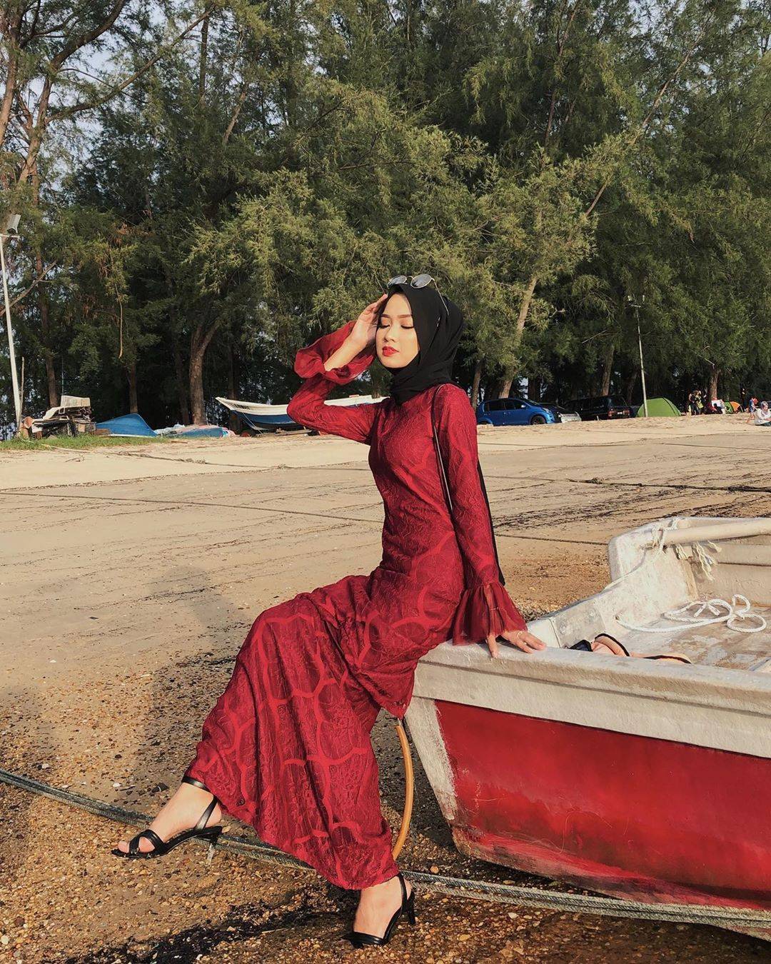 Hijabi in red traditional dress and heels. | Scrolller