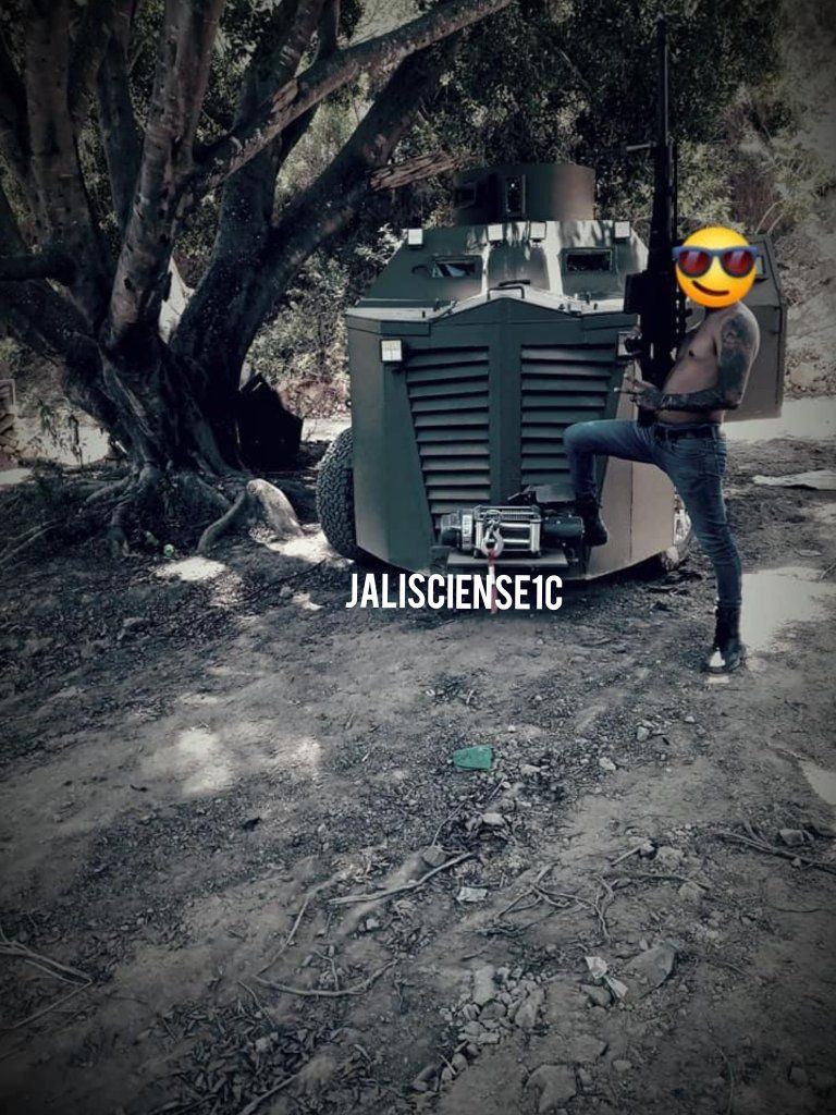 HITMAN OF THE CJNG POSES WITH A POWERFUL WEAPON AND MONSTER TRUCK ...