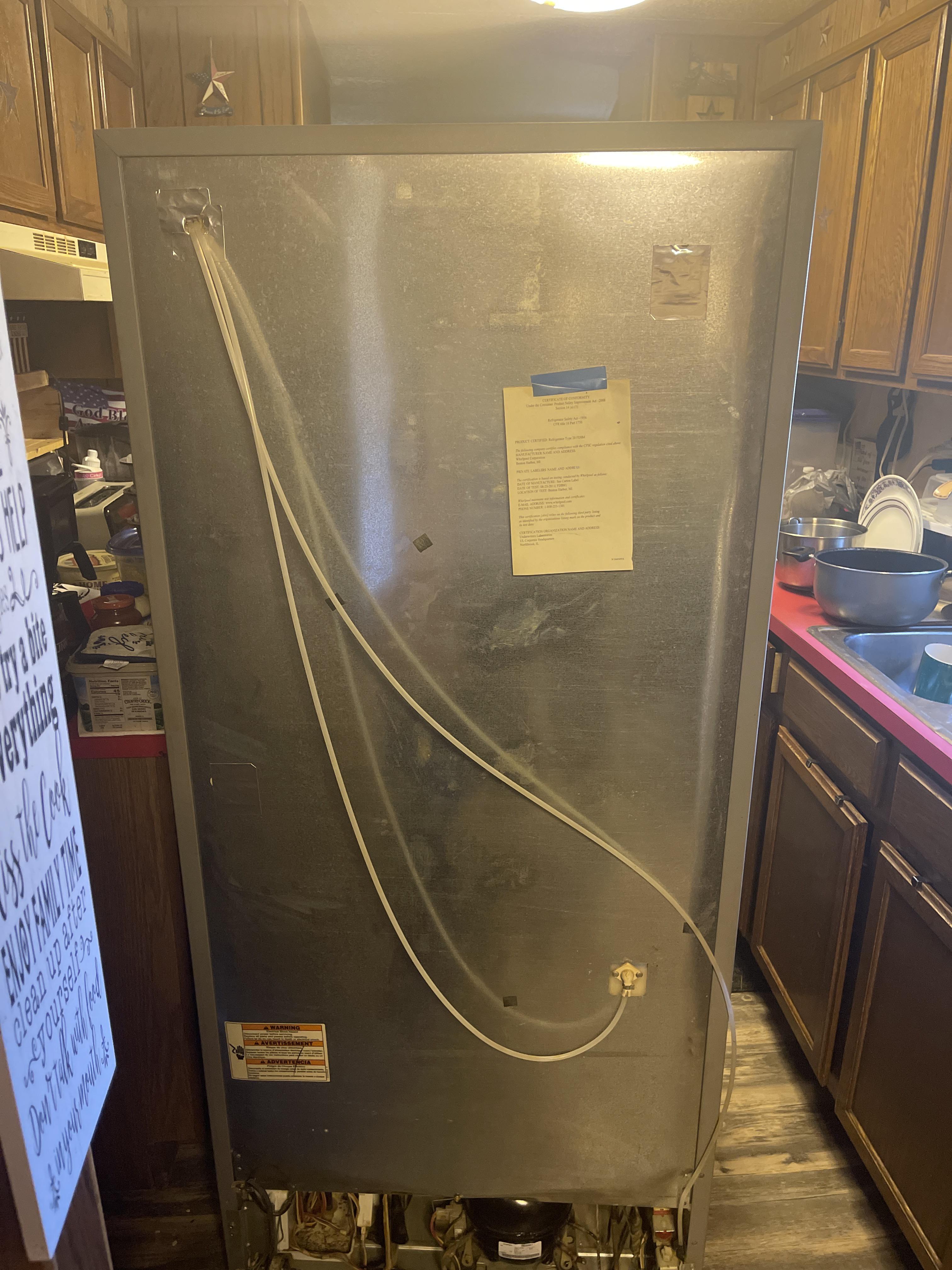 How to remove the back metal panel (not the cardboard at the bottom) on