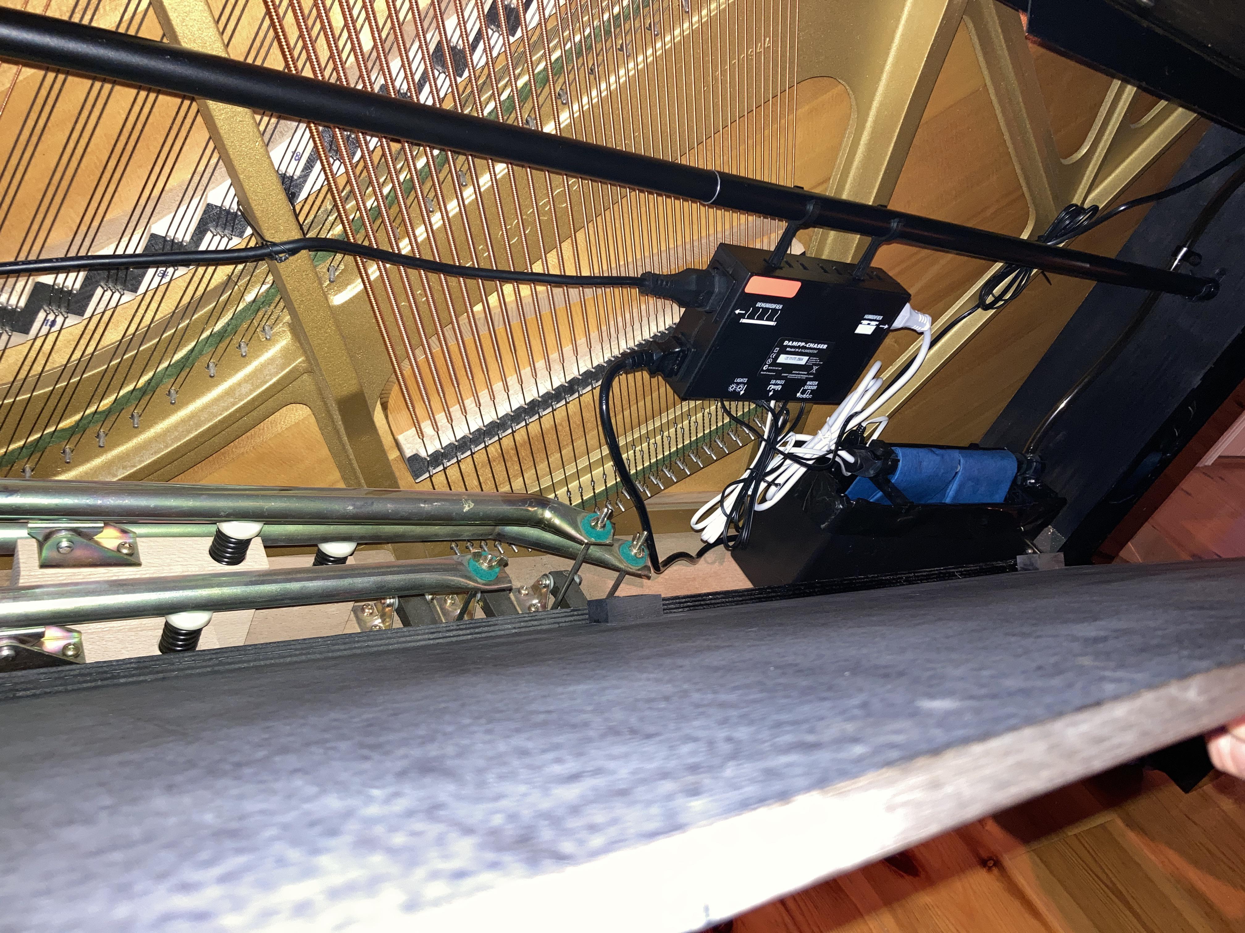 Humidifier built into a piano. Scrolller