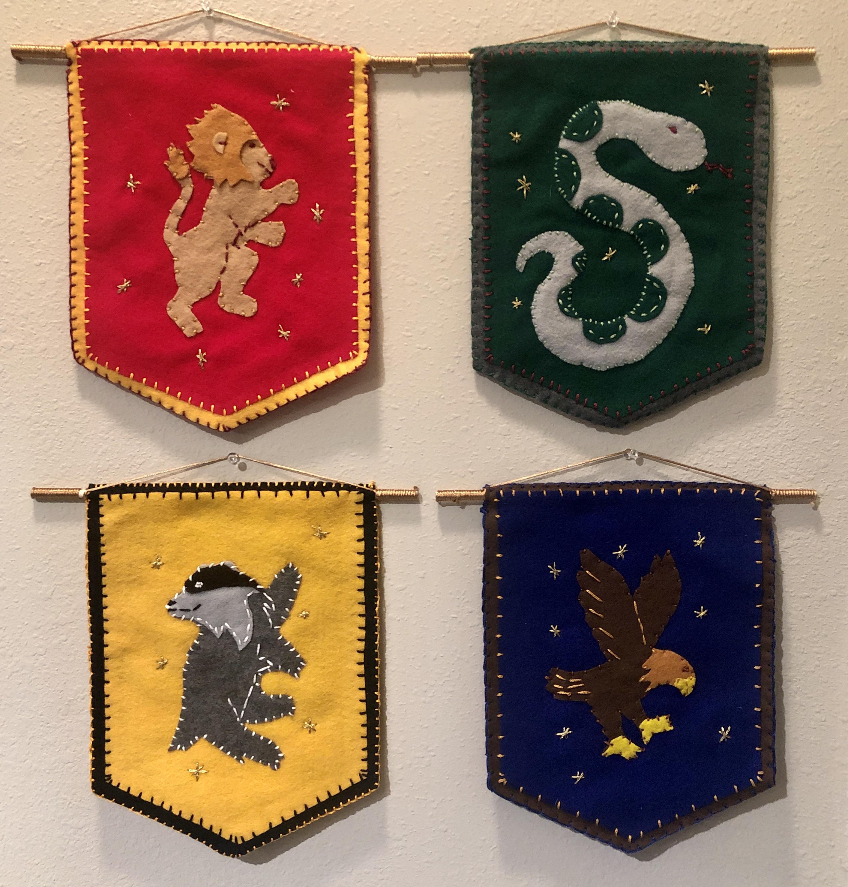I made some Hogwarts house banners for my best friends baby shower gift ...