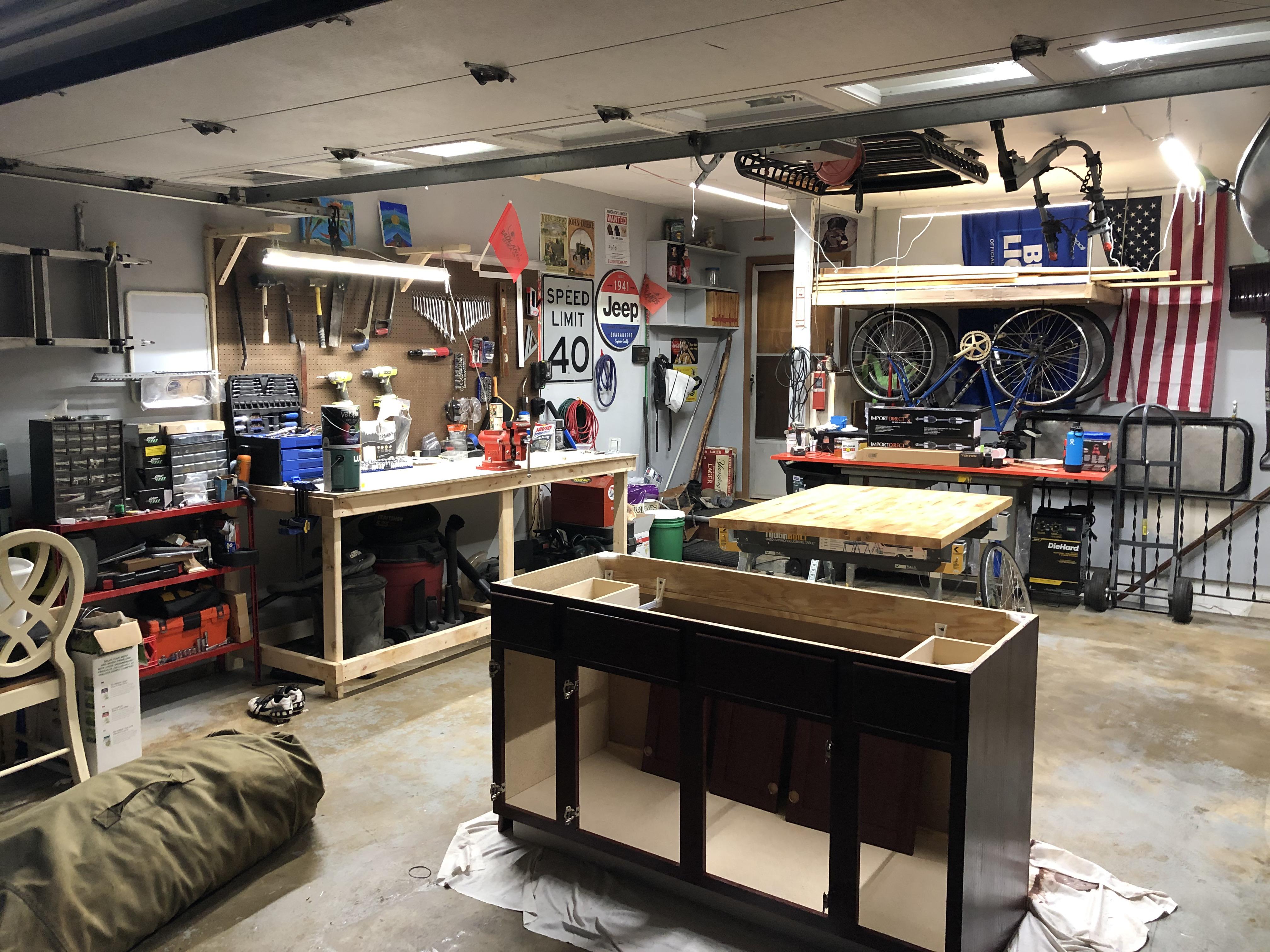 Just finished the overhead wood storage/bike rack tonight. This shop ...
