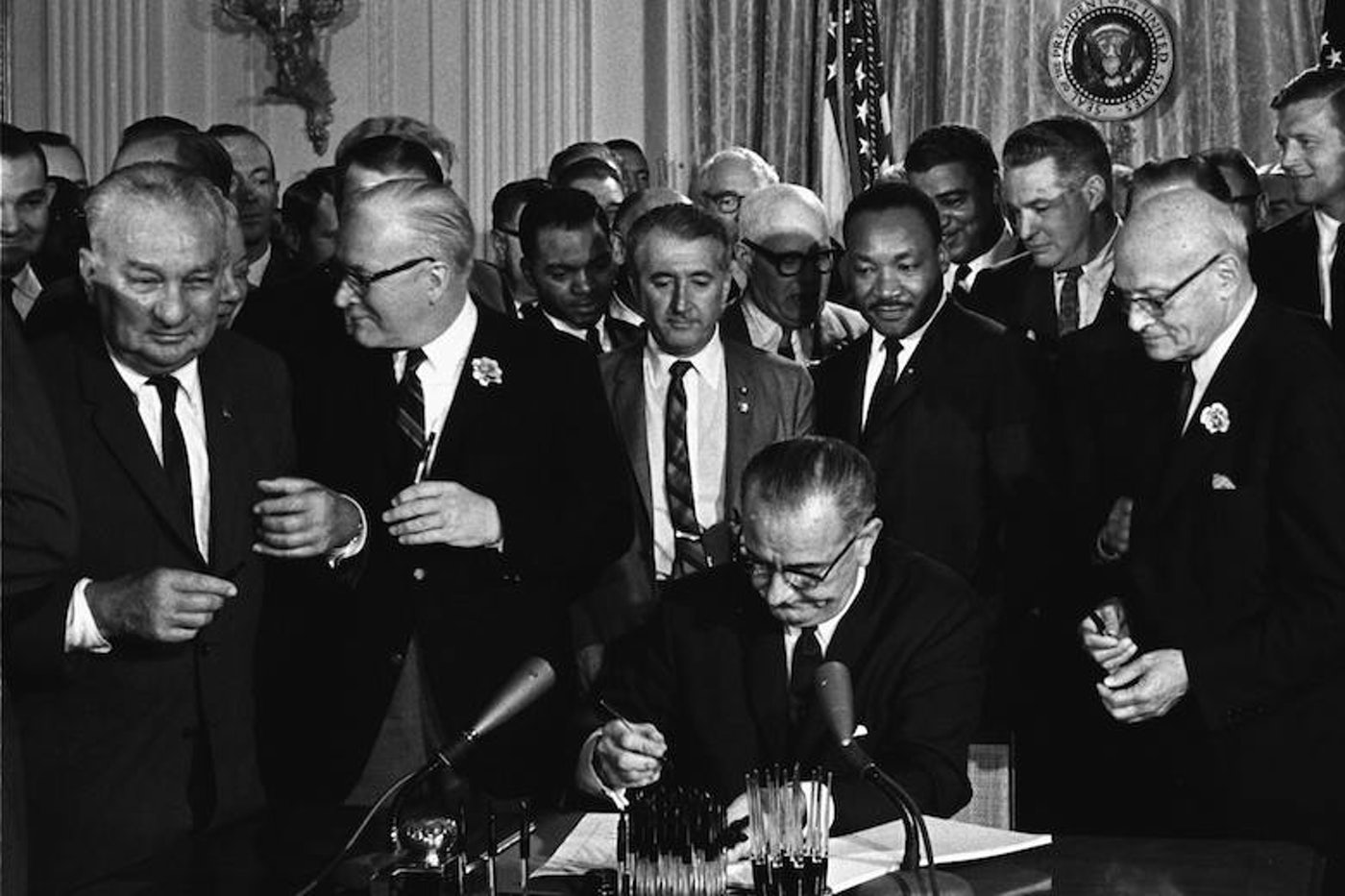 Lyndon Johnson signing civil rights act. 1964. | Scrolller