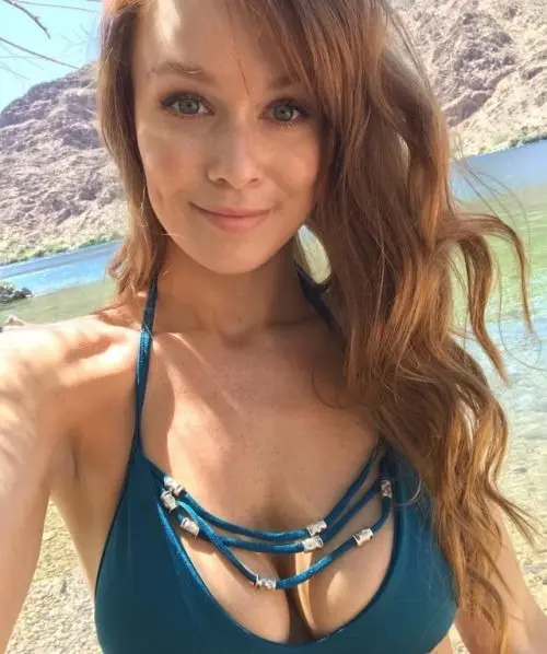 Leanna Decker, a busty redhead in lingerie, swimwear, and nude poses.