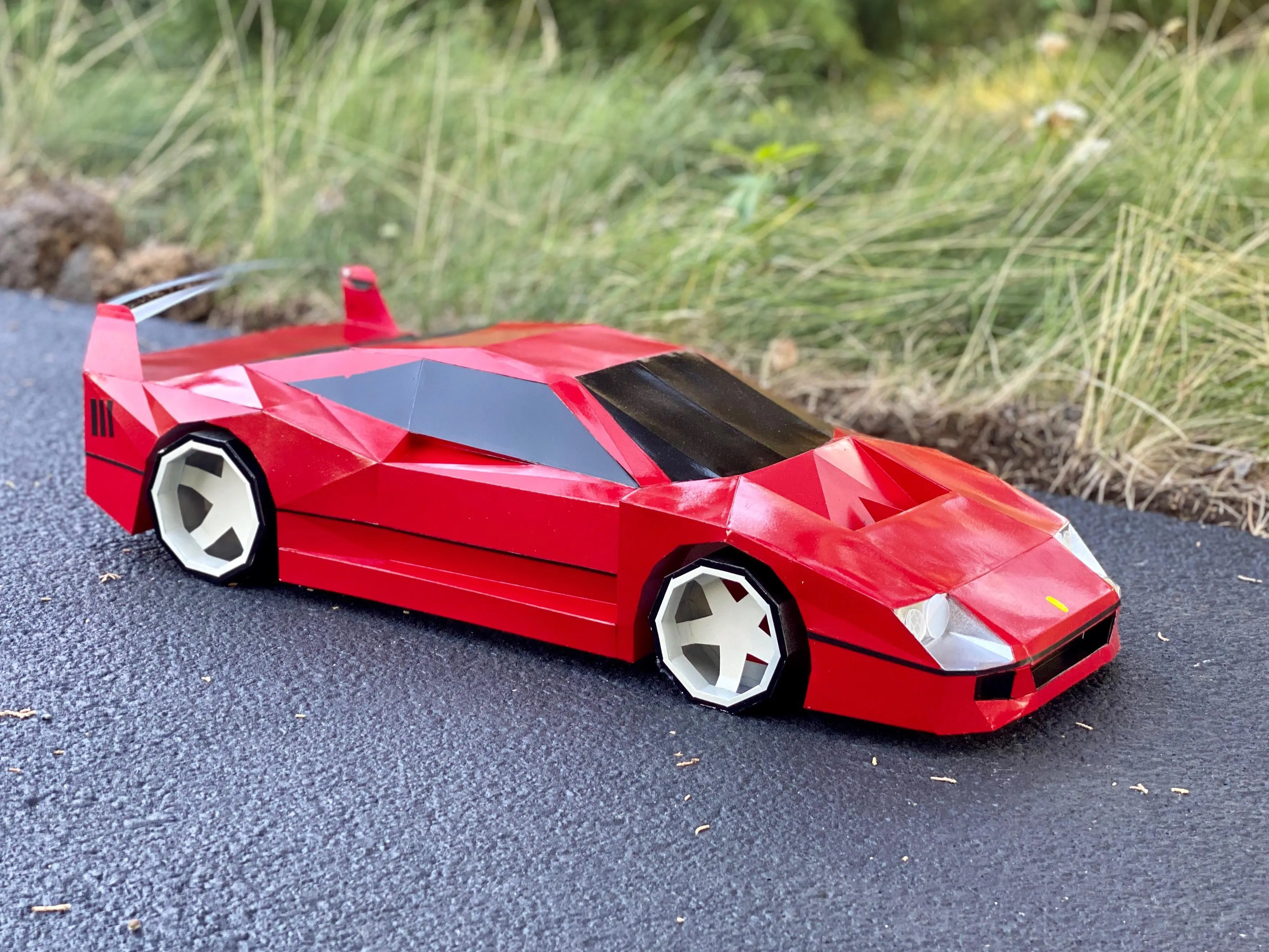 Over quarantine I’ve been making cars out of paper. Here is my 1:6 scale Ferrari f40 I finished recently. Let me know what you think!