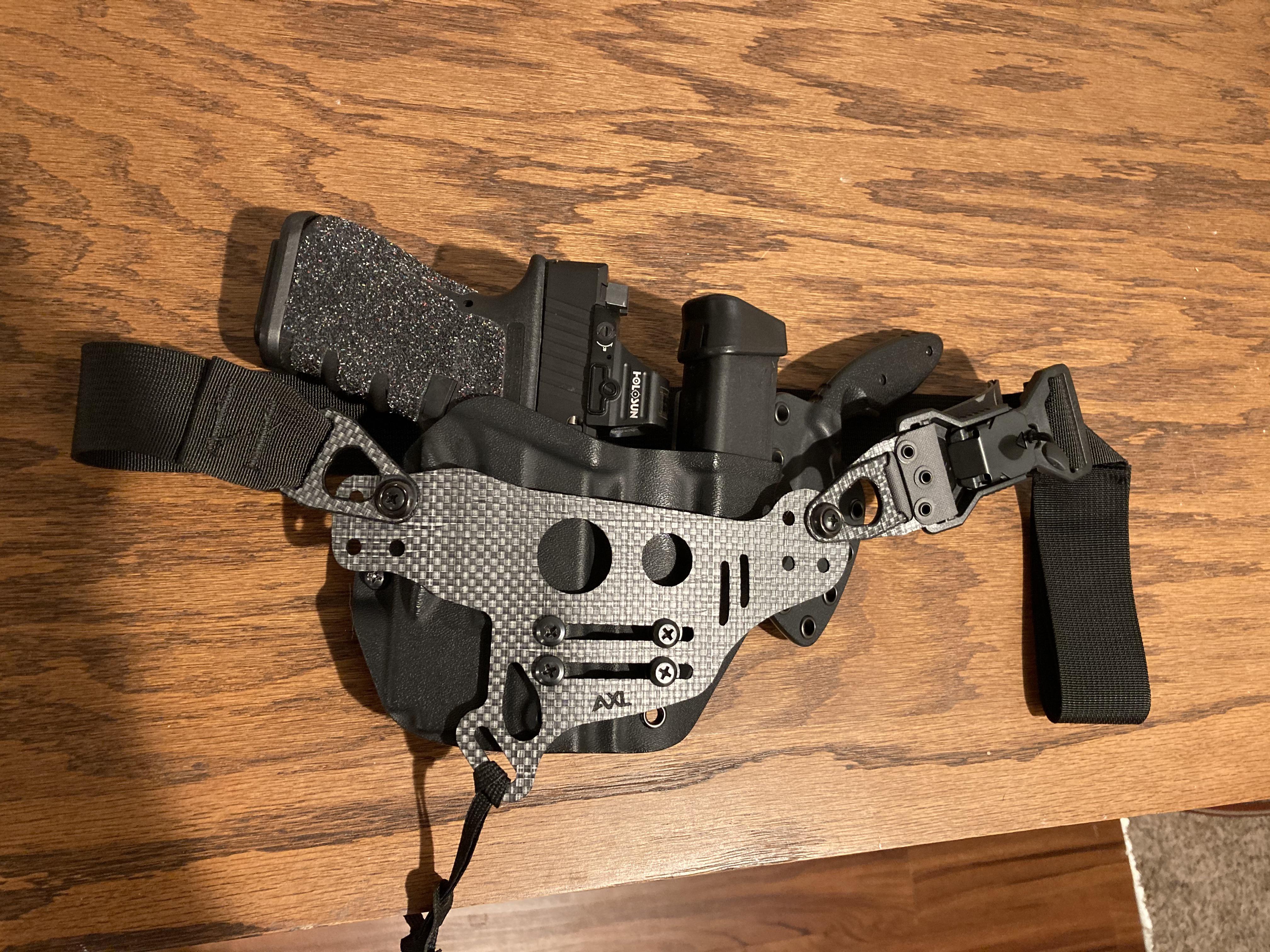 PHLster Enigma seems to work with sidecar holsters! Scrolller
