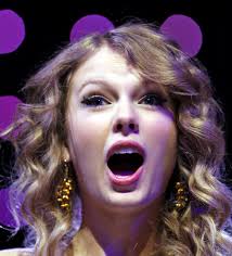 Taylor swift with her mouth wide open and ready | Scrolller