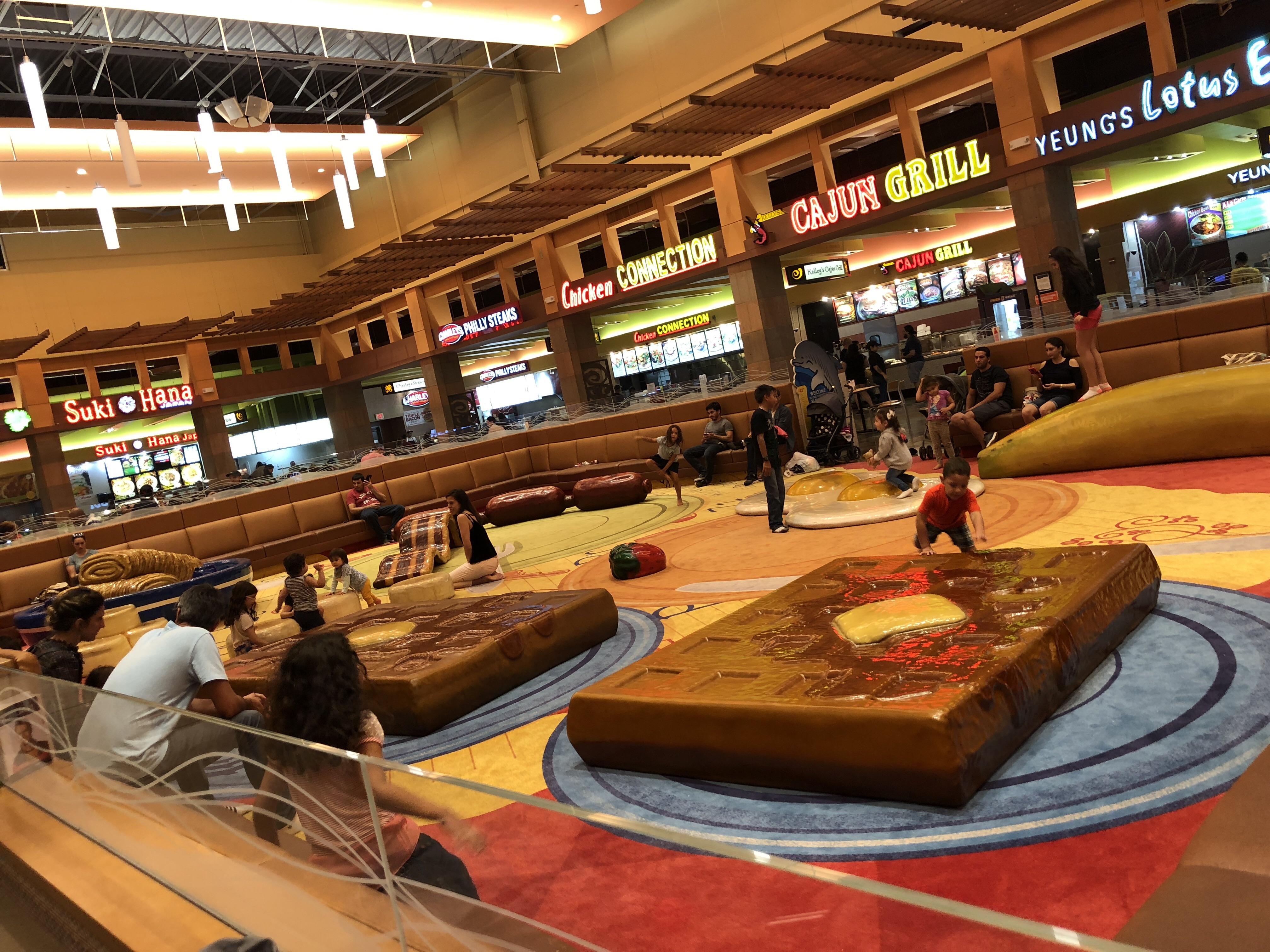 This weird breakfast themed playground in a mall food court. Scrolller