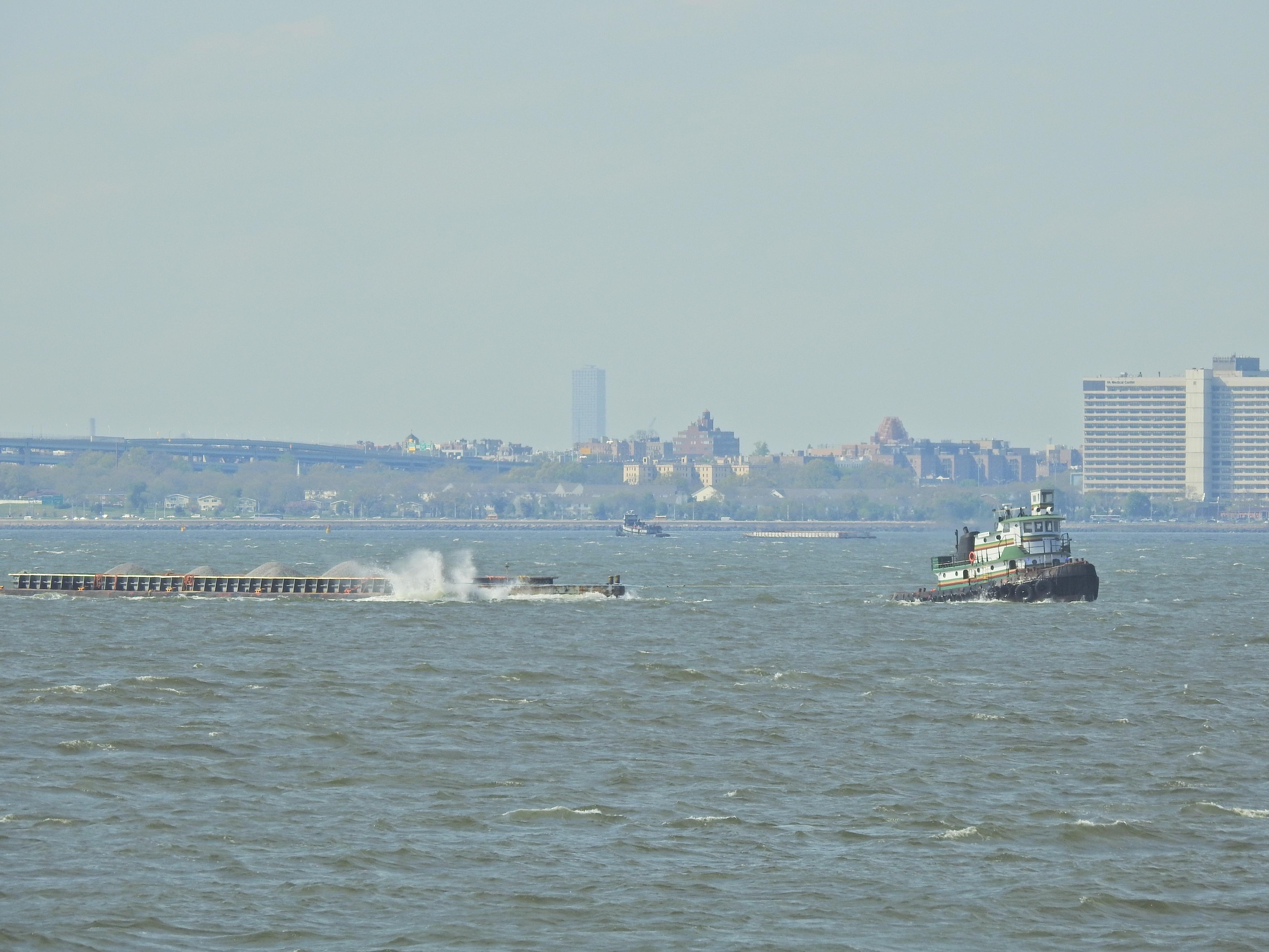 Tug Foxy 3 and Margot towing loaded hoppers on soft lines in NY Harbor ...