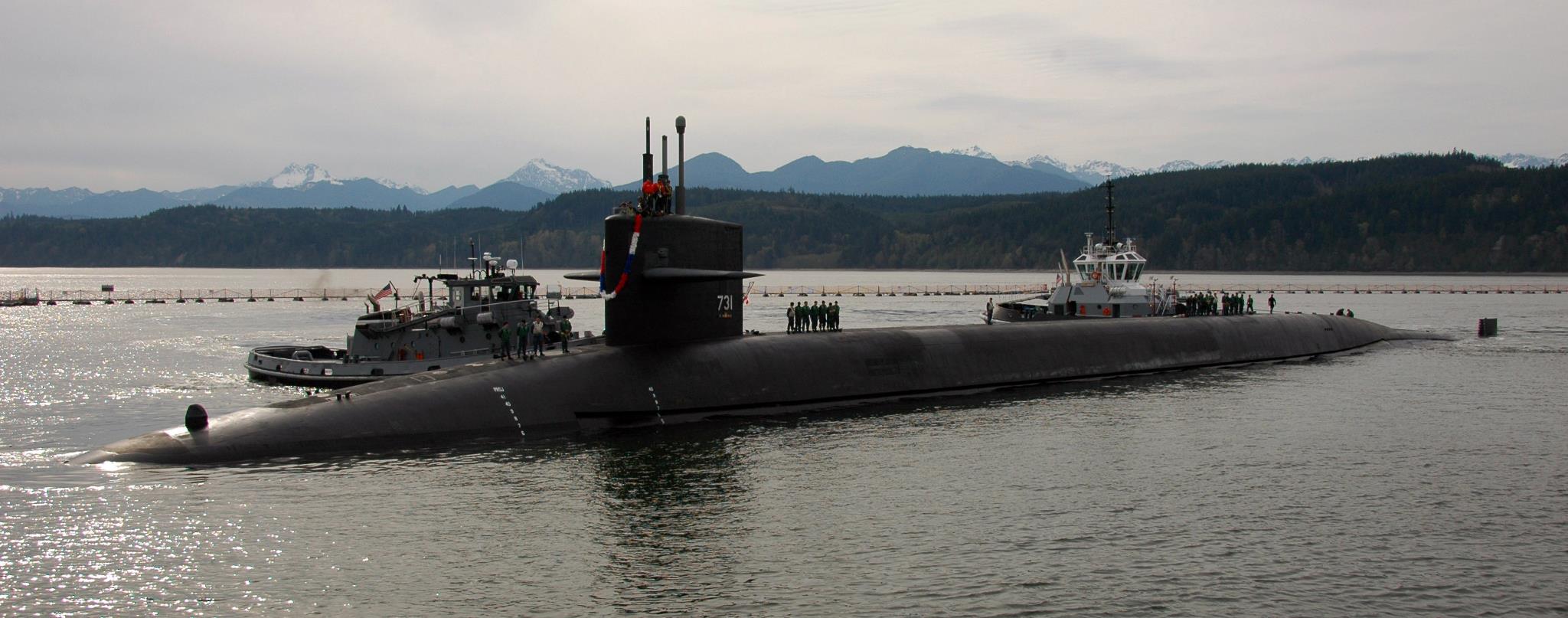 USS Alabama is helped by tugs at Bangor Submarine base.(Washington
