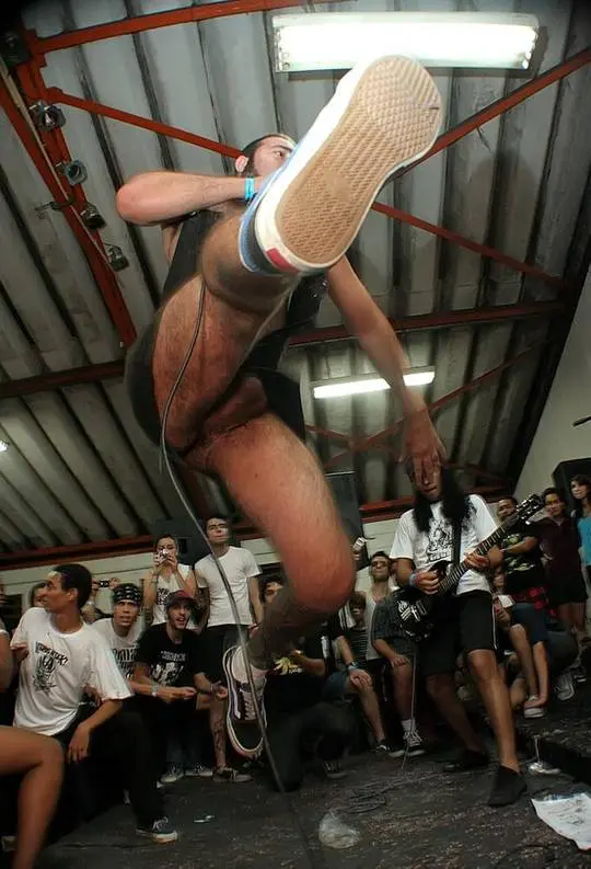 Muscular white man in athletic wear and grey underwear showing off his physique and white cock