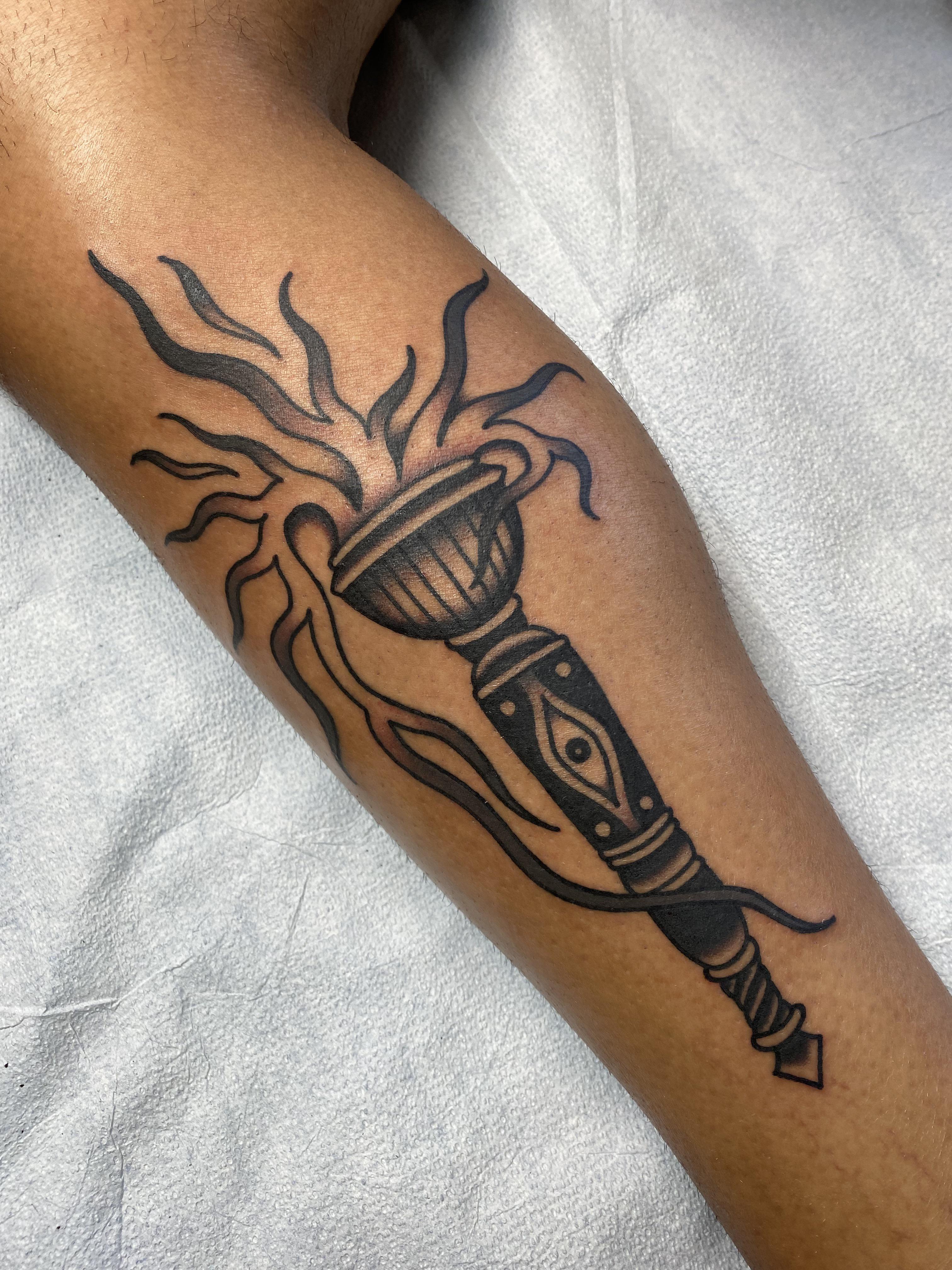 American traditional torch tattoo done by TPOT at Ocho Placas, Miami