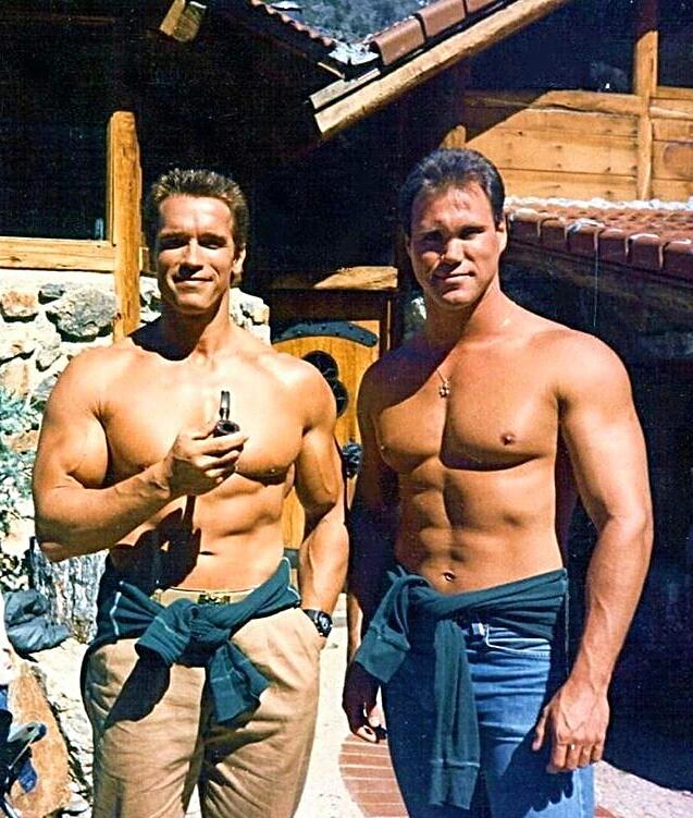 Arnold and his stunt double Peter Kent on set of Commando 1985. Scrolller