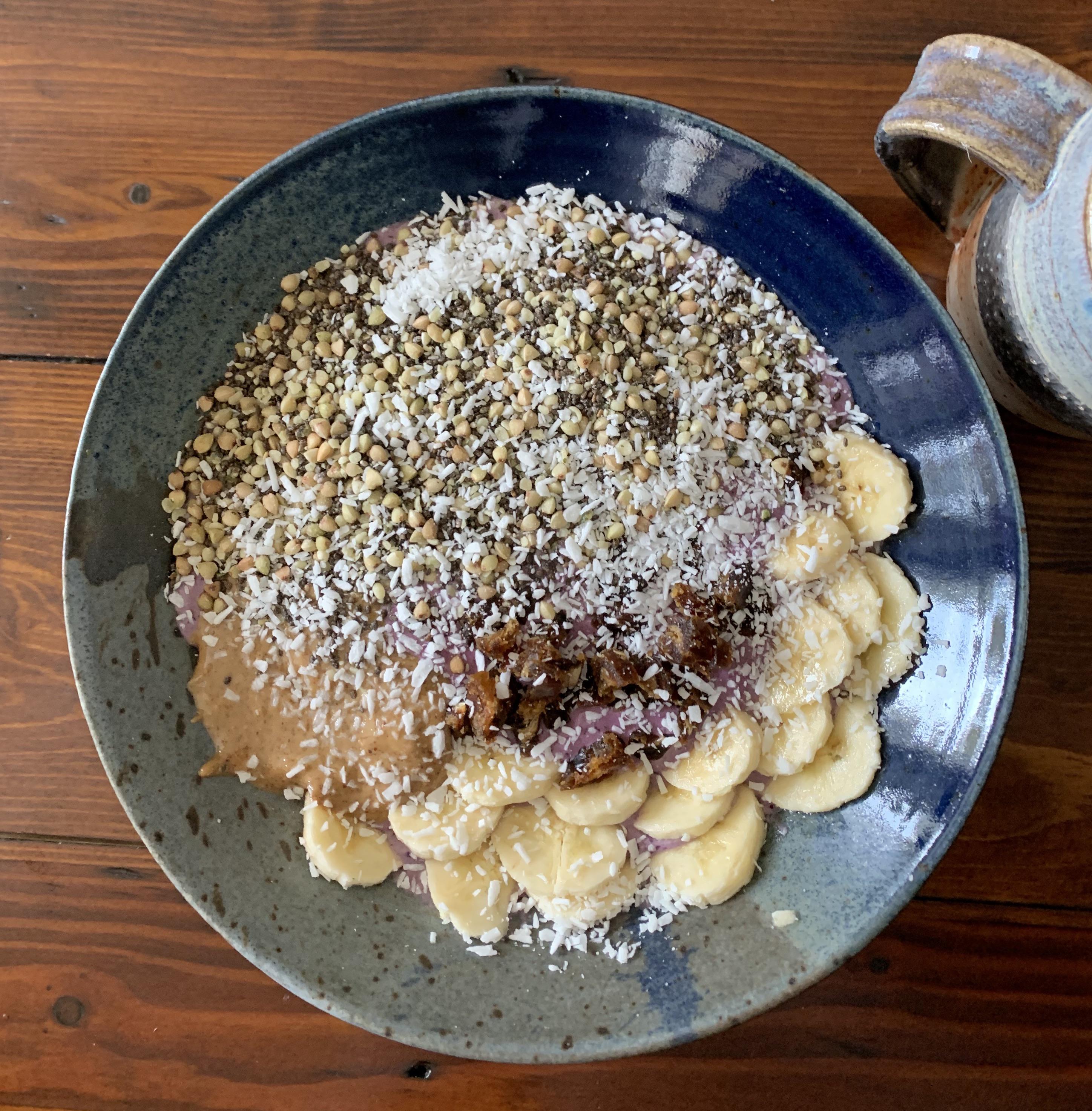 Blueberry basil smoothie bowl with banana, dates, almond butter, chia, and buckwheat groats