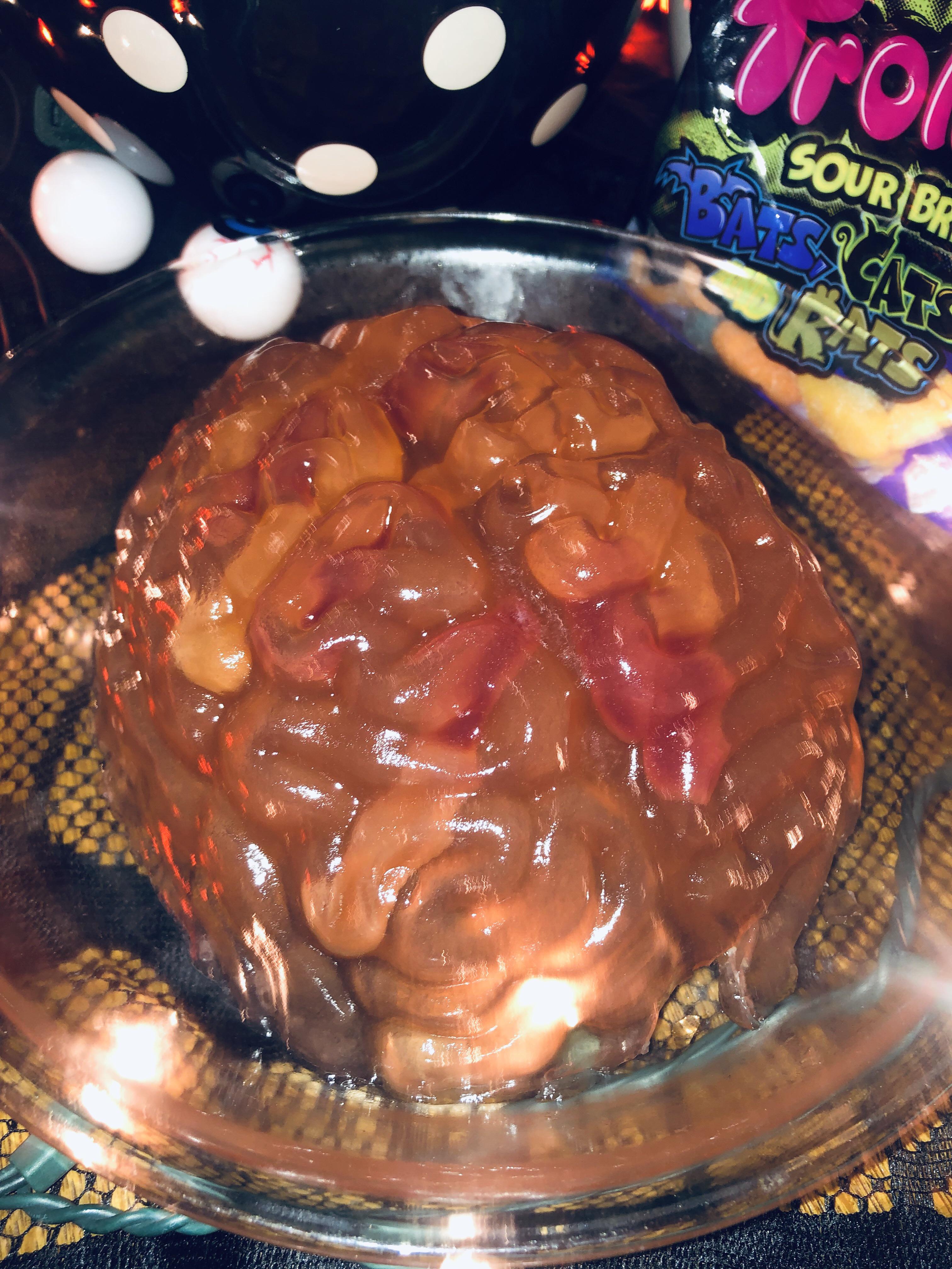 Brain jello mold with gummy worms made for a Halloween party in august Scrolller