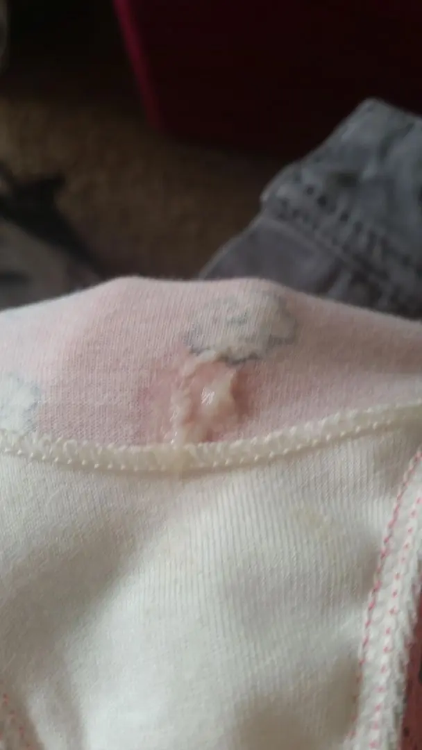 Woman showing dirty panties with wet panty nectar and underwear marks on the gusset