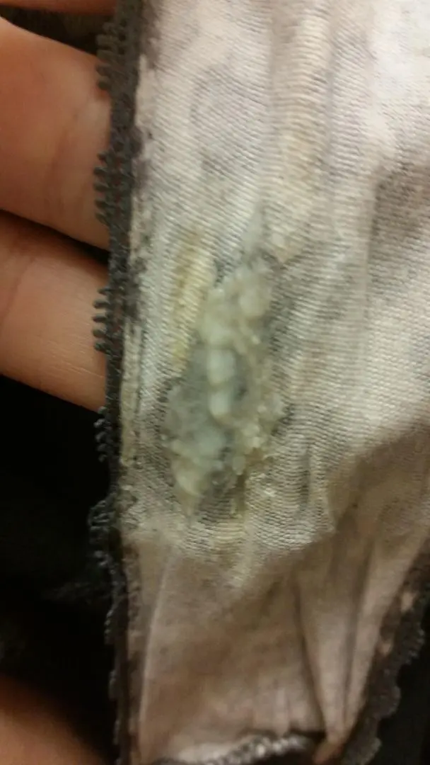 Woman showing dirty panties with wet panty nectar and underwear marks on the gusset