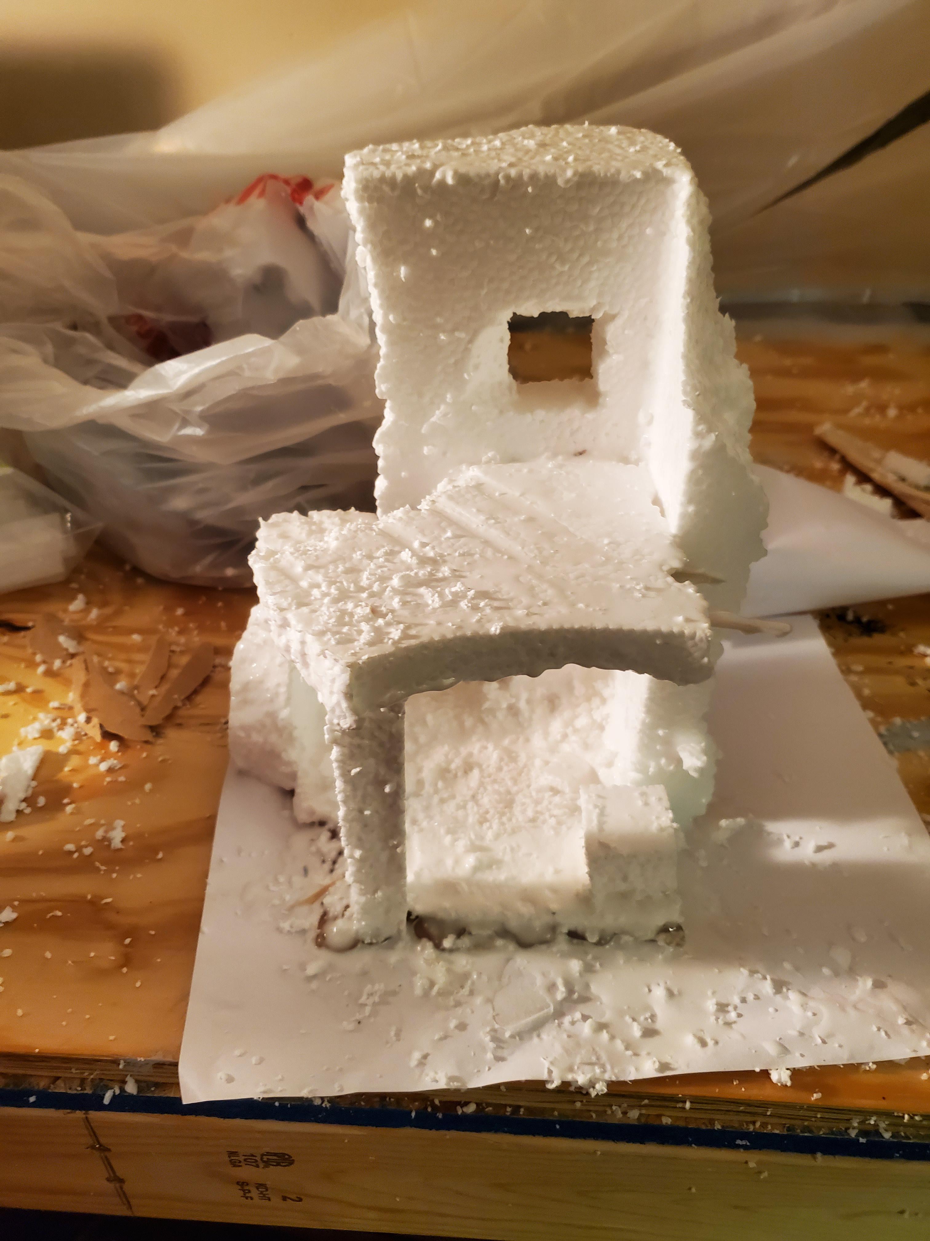 First step cut foam, then burn finger on glue gun, repeat until a rough