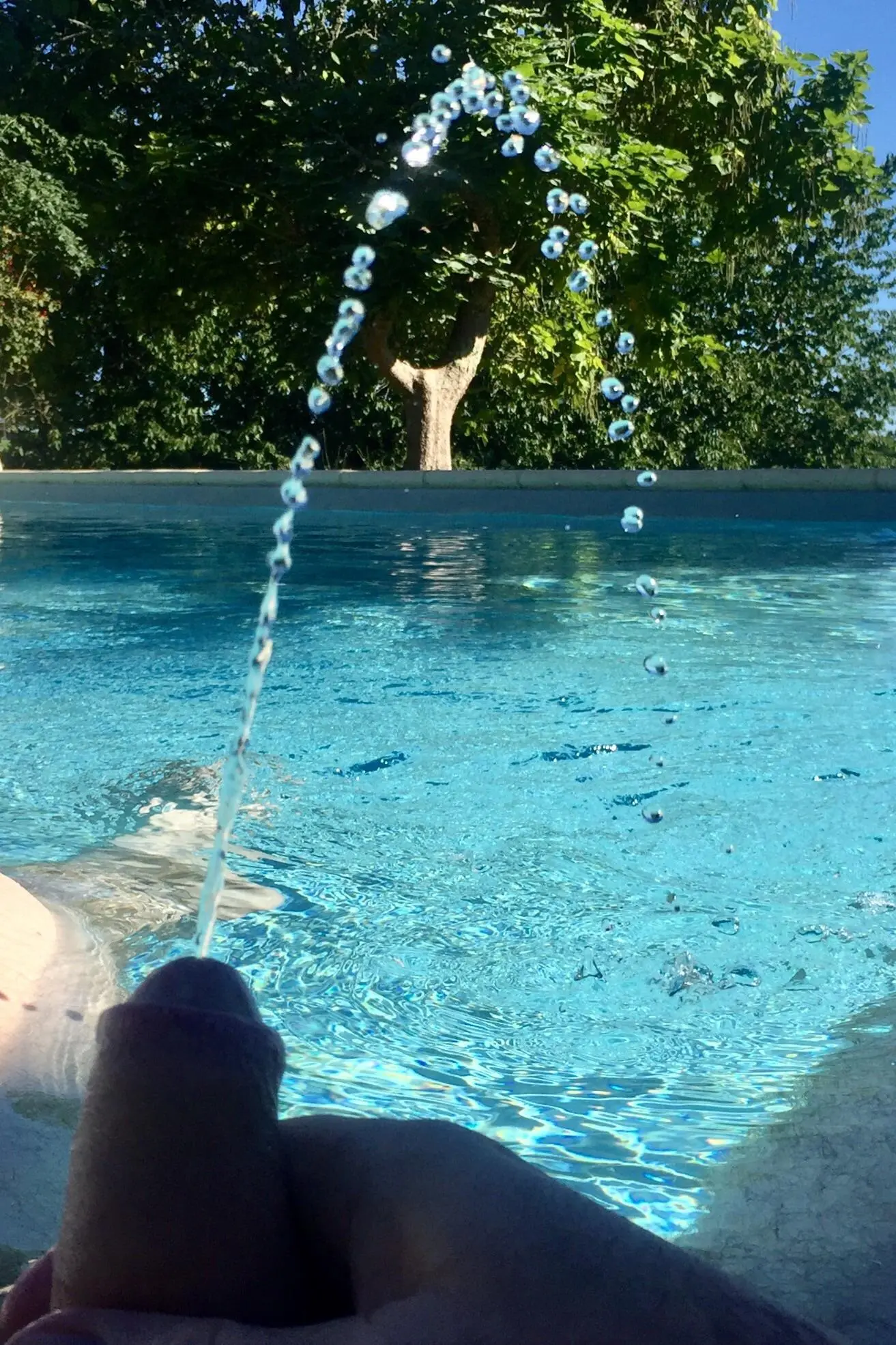 Scrolller Pool Fountain by the pool | Scrolller