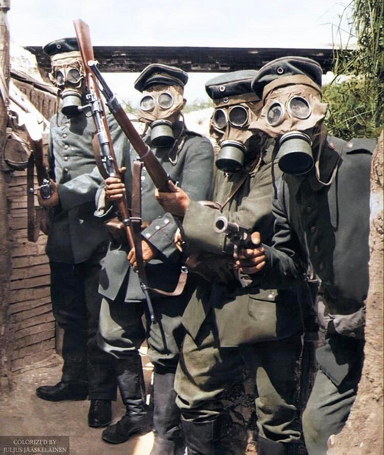 German soldiers posing in the trenches wearing gas masks in 1916 ...