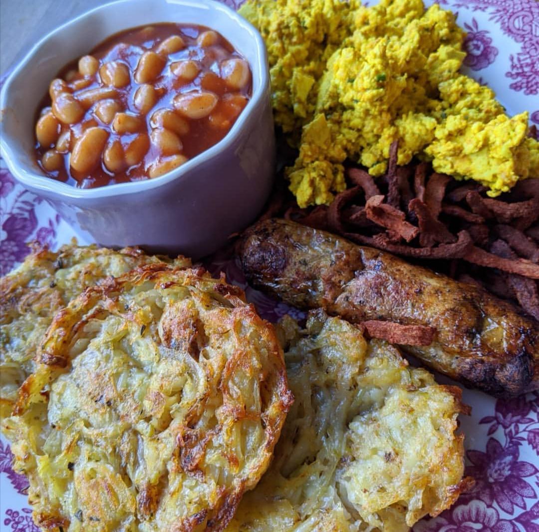 Homemade hash browns, scrambled tofu, baked beans, bacon and sausages. 100 vegan and gluten