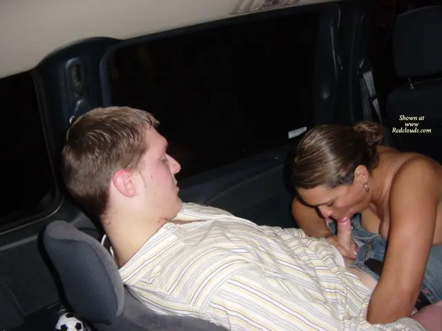 Hotrican busty latina woman and white man in a car, woman flashing her breasts