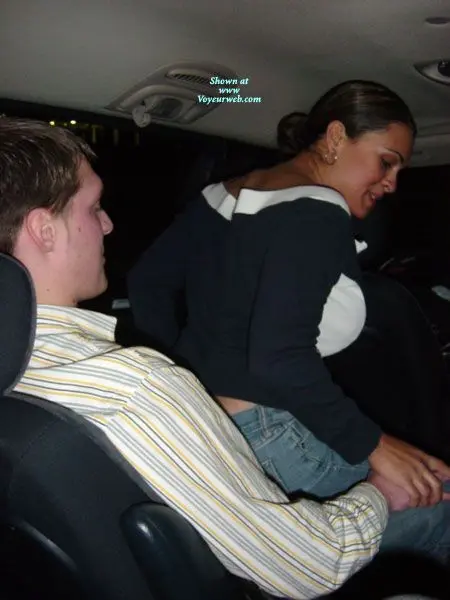 Hotrican busty latina woman and white man in a car, woman flashing her breasts