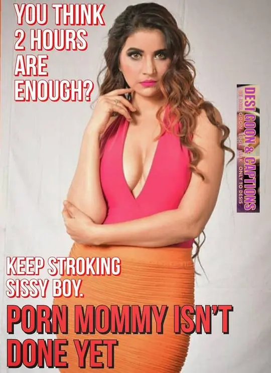 Curvy Indian woman in a pink v-neck top and orange pencil skirt posing for desi sissy captions