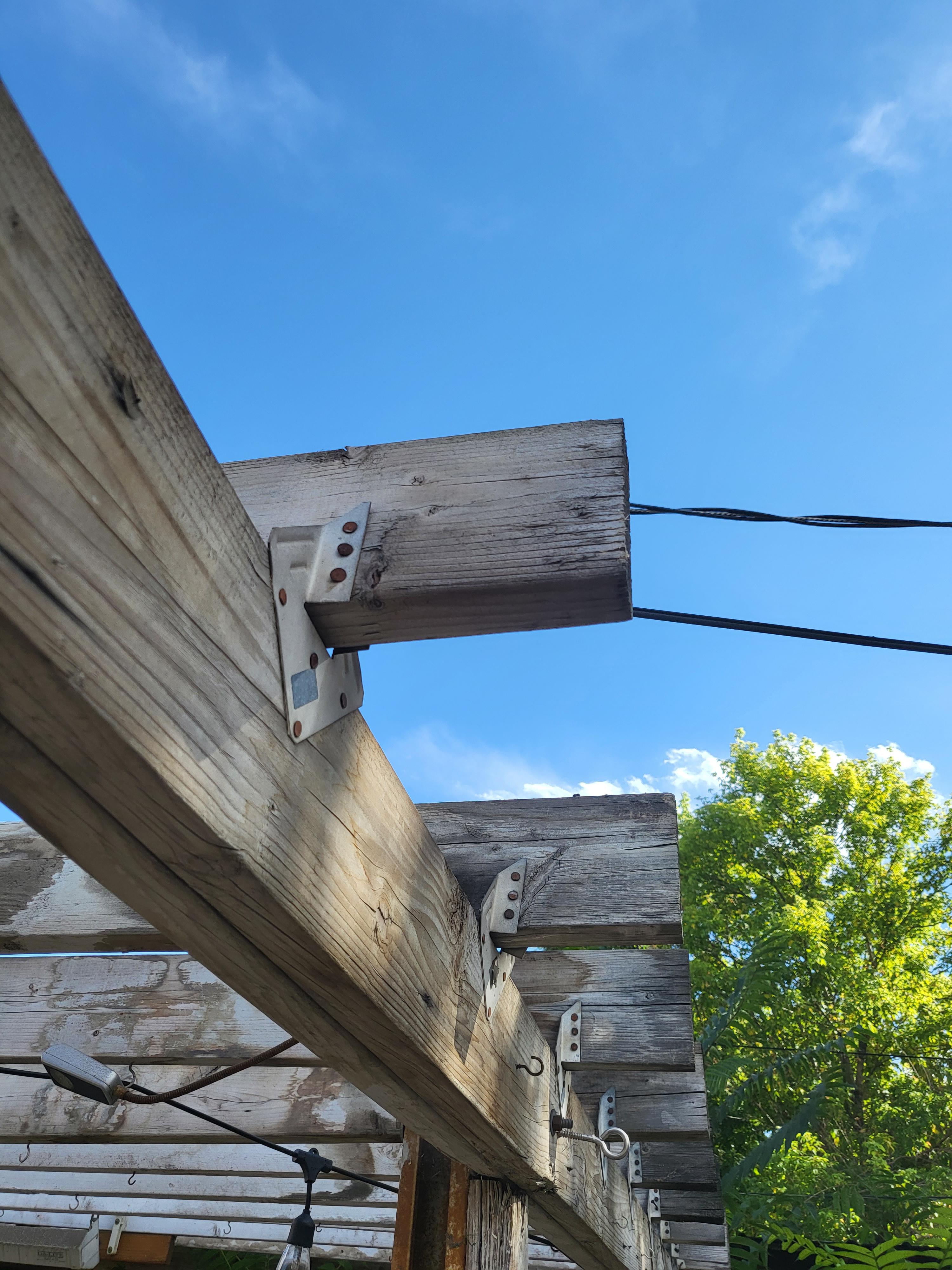 How to efficiently take down old patio roof? Many rusty nails are