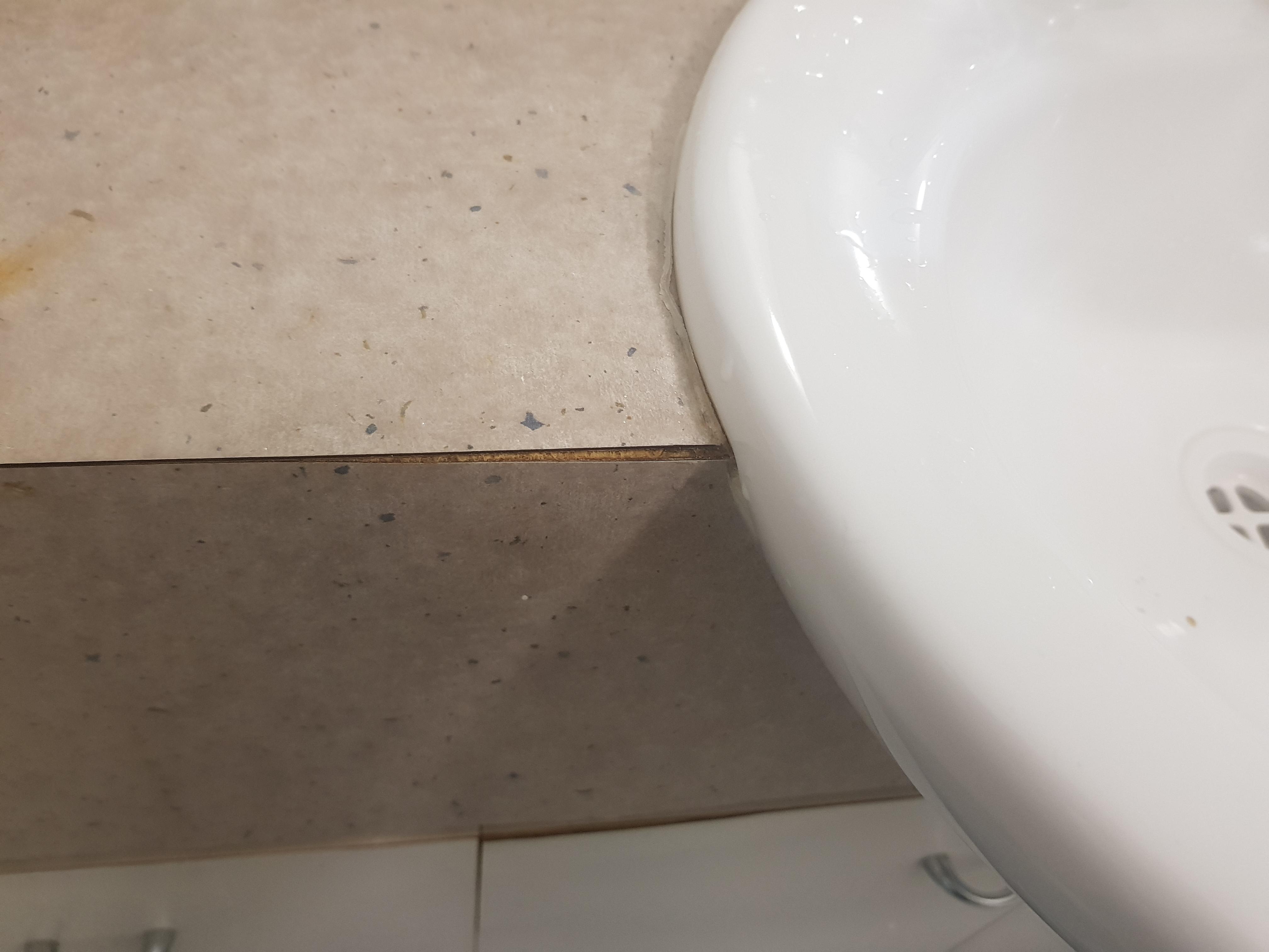 How to stop water expanding chipboard? My teenager leaves water all