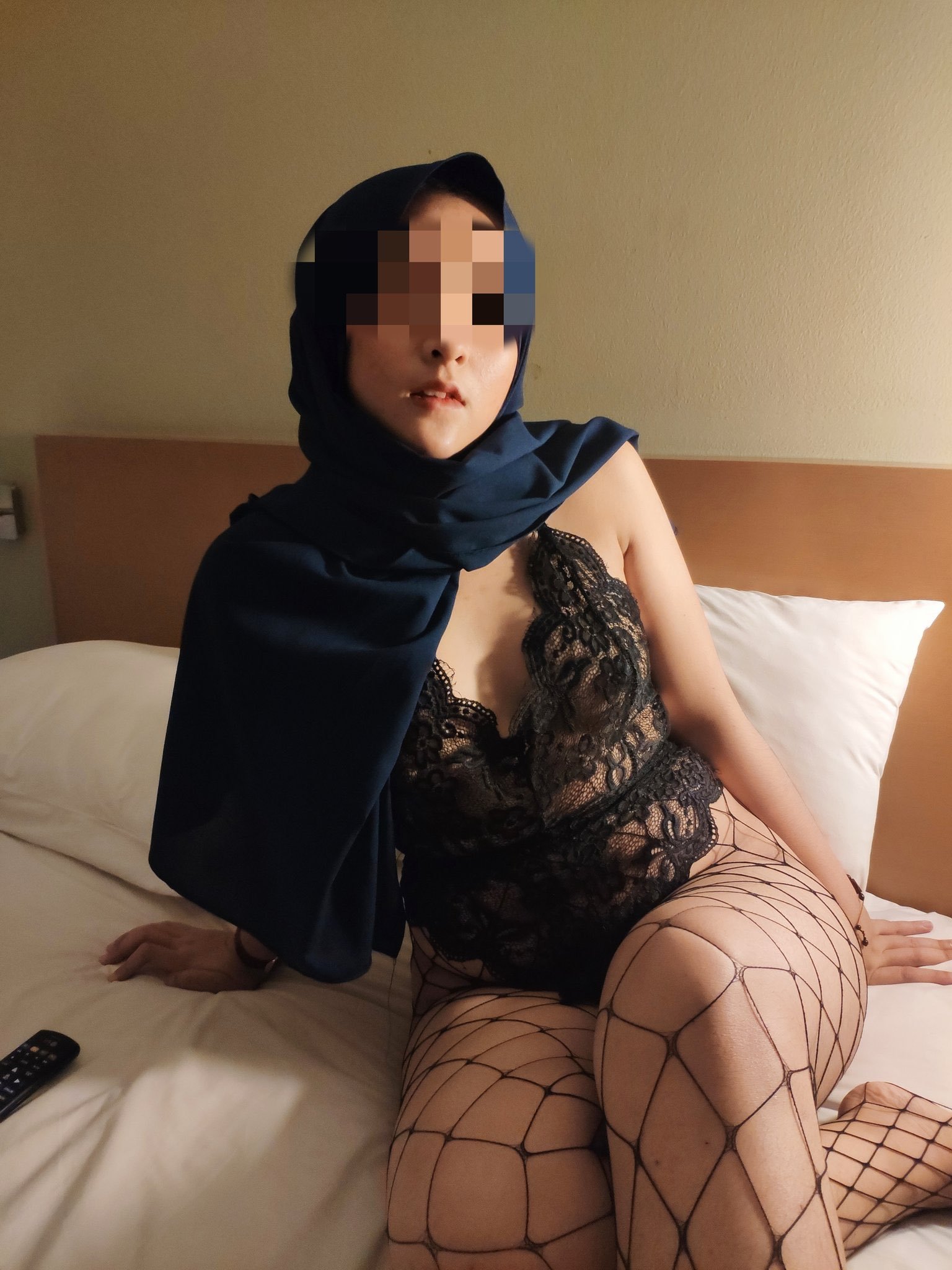 Indonesian hijabslut in lingerie and fishnets. scrolller