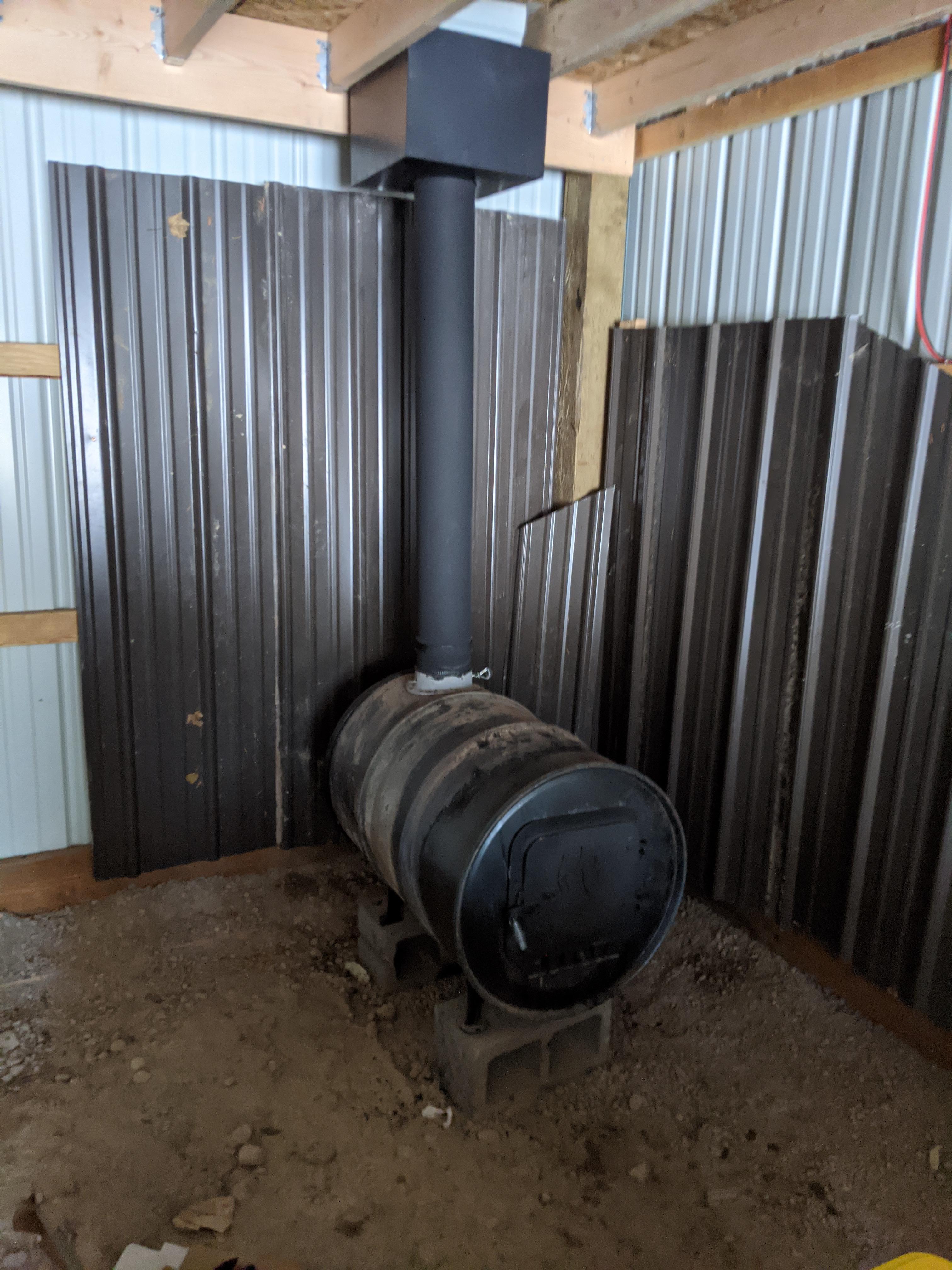 Installed a stove in the pole barn. Just in time for 12 inches of snow this weekend + DIY heat