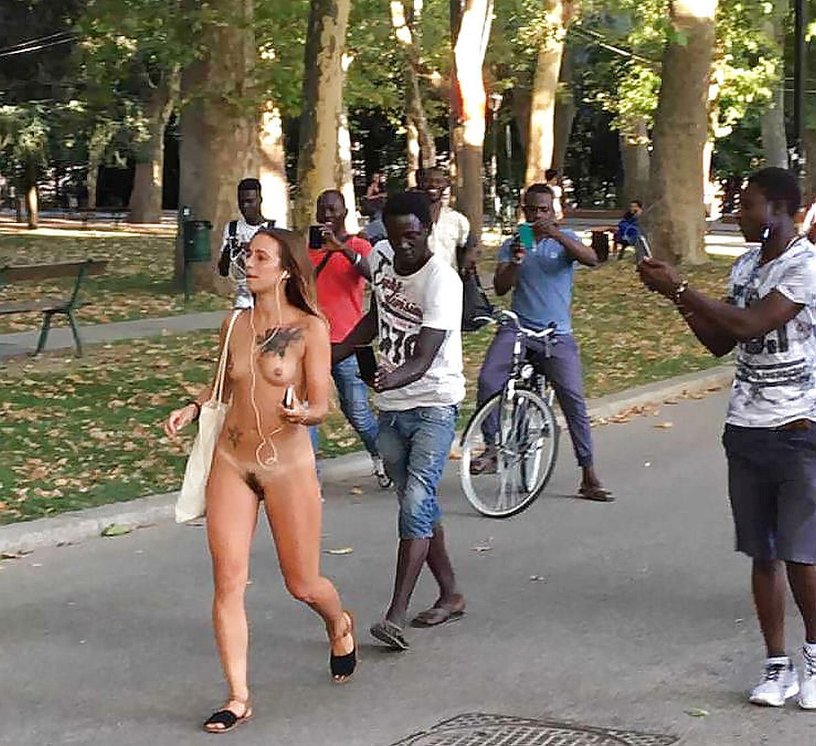 Italian Woman Gathering A Crowd As She Walks Naked Through The Streets Of Bologna Italy Scrolller