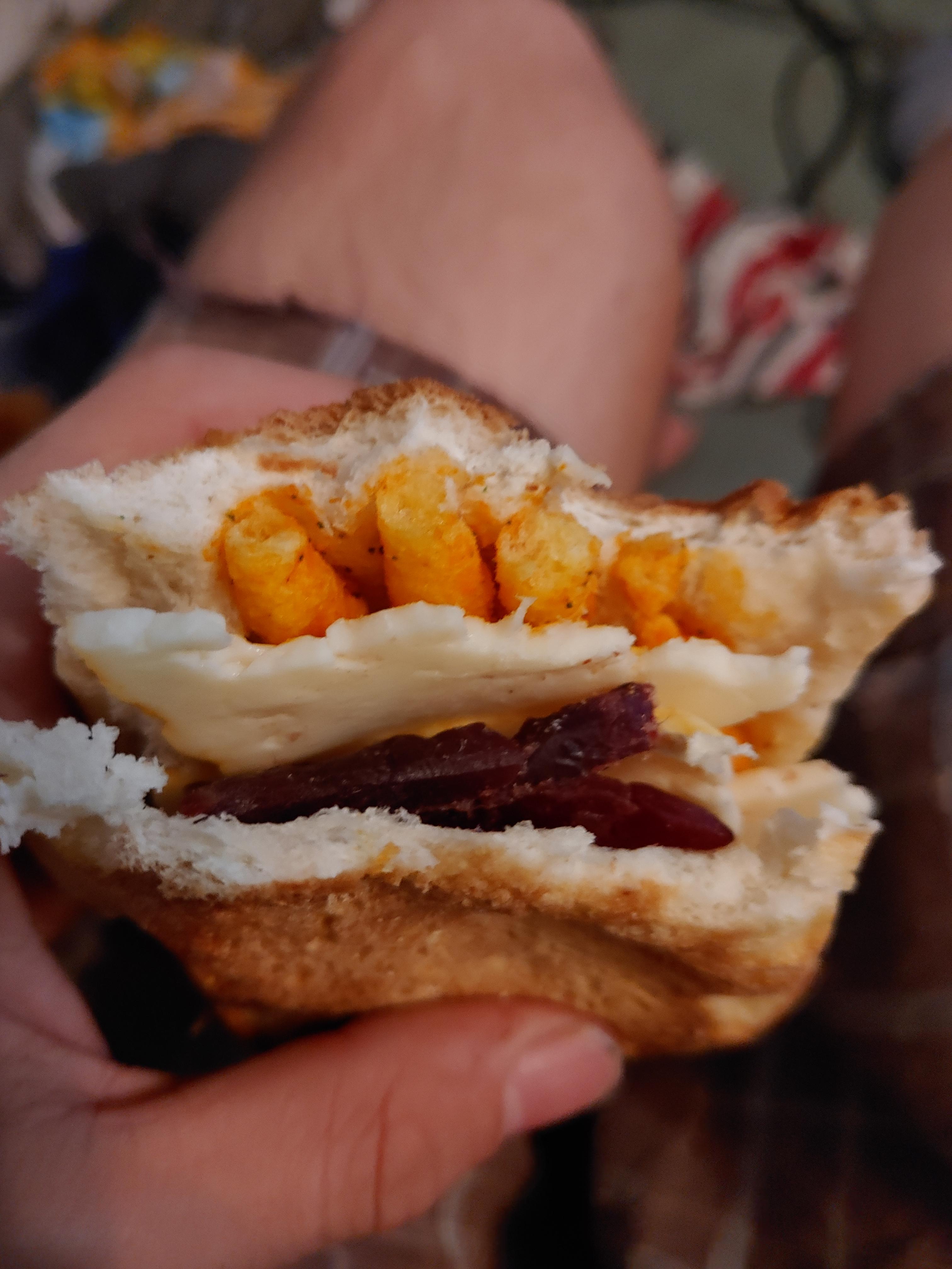 Jalapeno Cheetos, munster cheese, and smoked beef jerky on a hotdog bun
